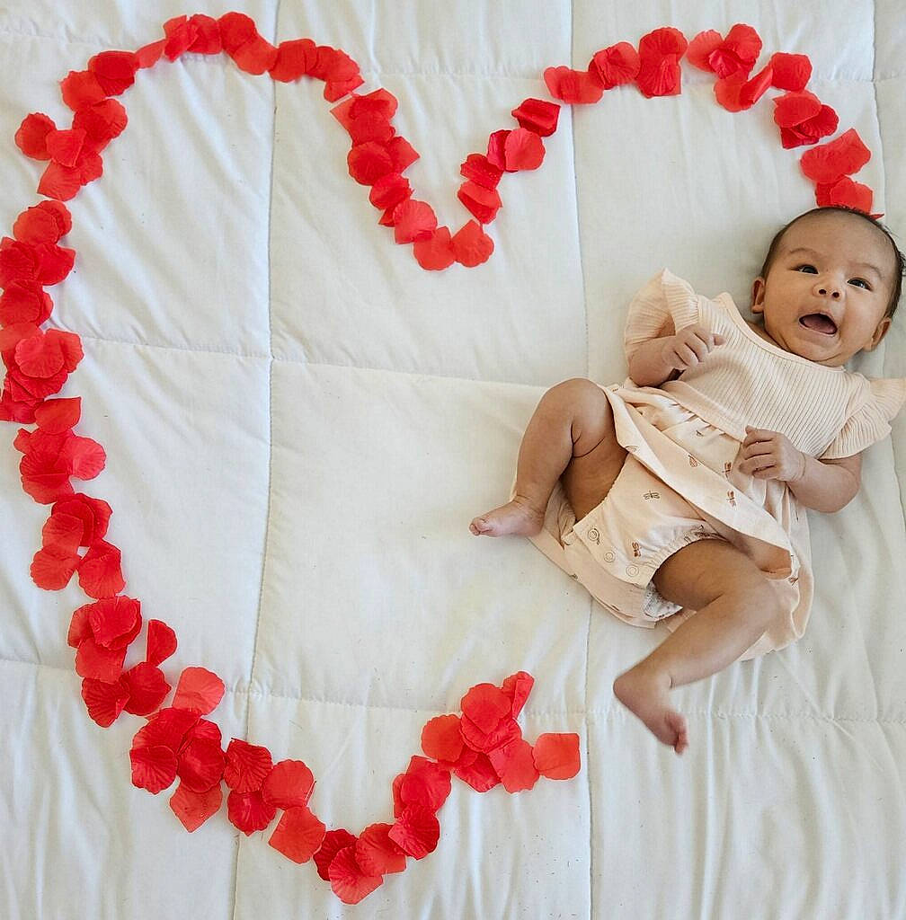 Elianna joined the competition — help win amazing prizes! baby, baby_sleeping, baby_toddler_clothing, carmine, comfort, event, font, gesture, happy, linens, pattern, peach, person, petal, pink, product, red, sleeve, textile, toddler