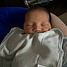 Zion is registered to the contest to win money with this photo: baby, newborn, sleeping, blanket, infant, peaceful, face, human, portrait, closeup, soft_lighting, indoors, resting, wrapped, cozy, cute, child, person, calm, toddler