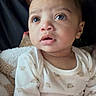 Zyaire joined the competition — help win amazing prizes! baby, child, infant, onesie, bear_pattern, blanket, curious, wide_eyes, soft_lighting, portrait, indoor, person, cute, cozy, clothing, young_child, snug, looking_up, human, toddler
