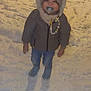 Ismaël participe au concours pour gagner de l'argent avec cette photo : child, toddler, pacifier, snow, winter_clothing, hood, hat, jacket, jeans, boots, bead_chain, standing, outdoors, night, cold_weather, cute, smile, snow_covered_ground, portrait, playful