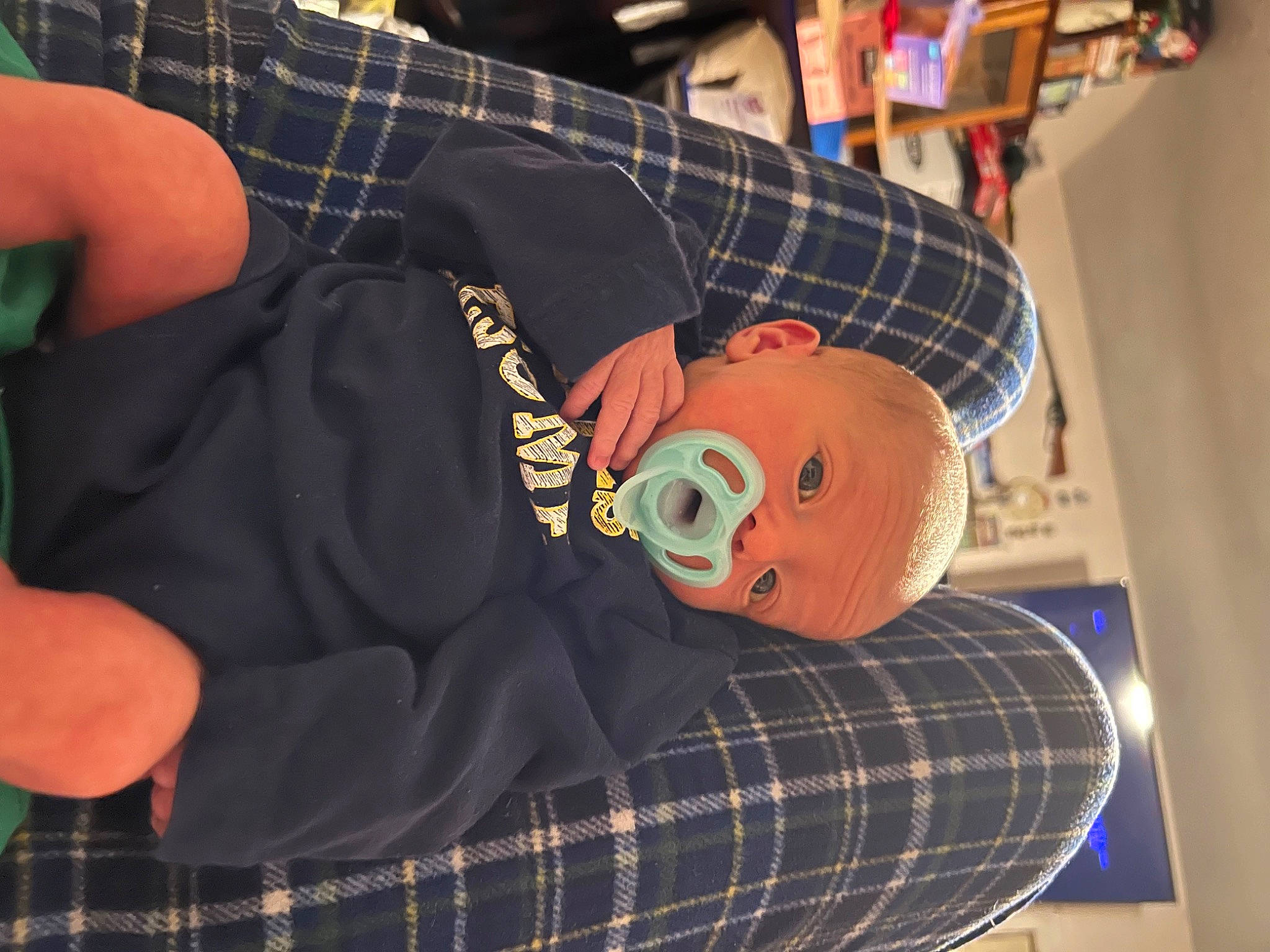 Martin joined the competition — help win amazing prizes! baby_toddler_clothing, carmine, comfort, design, elbow, hat, linens, pattern, person, personal_protective_equipment, plaid, plush, room, sitting, sleeve, stuffed_toy, tartan, textile, thigh, toy