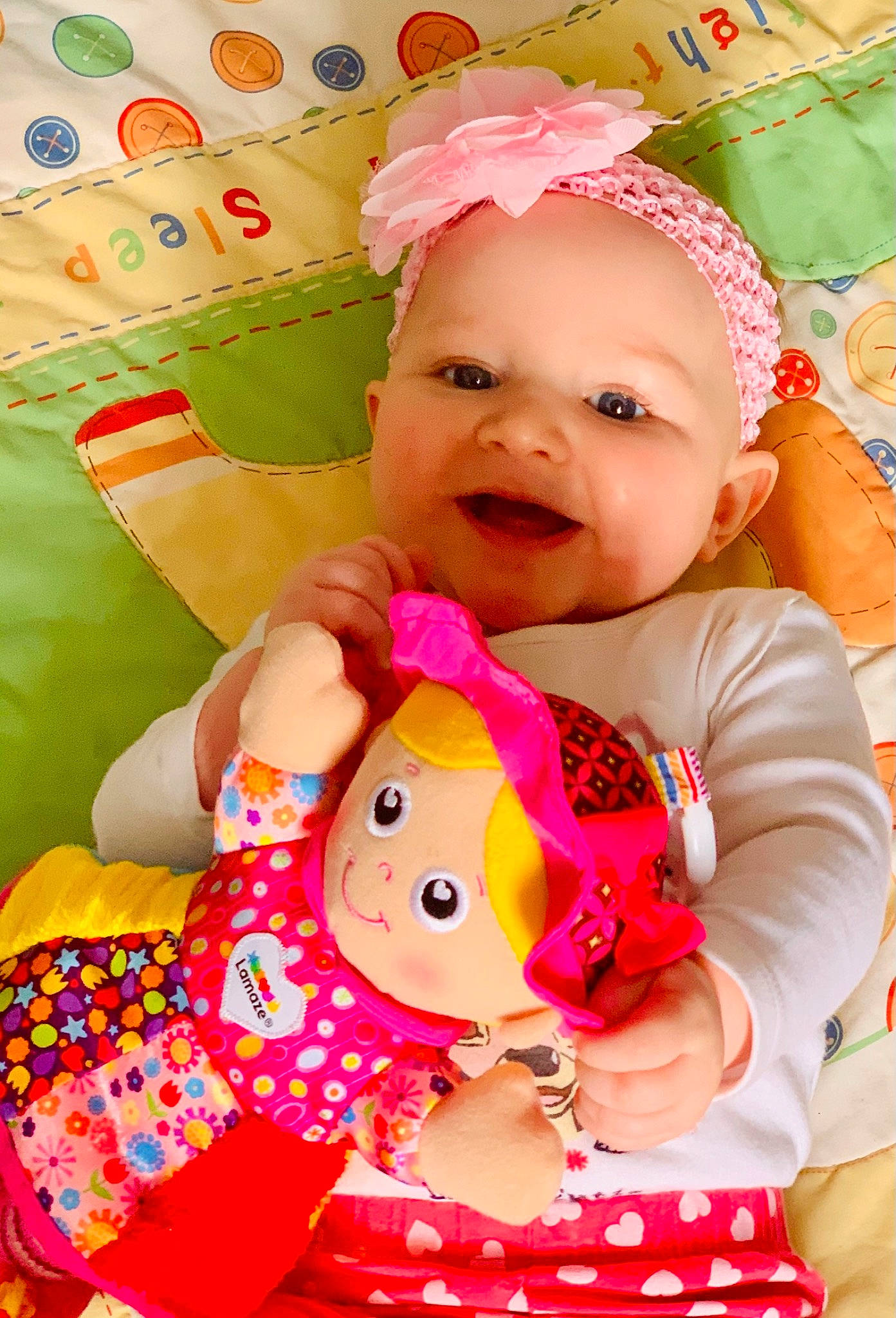 Lacie is registered to the contest to win money with this photo: baby, baby_laughing, baby_toddler_clothing, cheek, child, clothing, dress, face, facial_expression, fun, happy, headwear, magenta, pattern, person, pink, product, skin, sleeve, smile