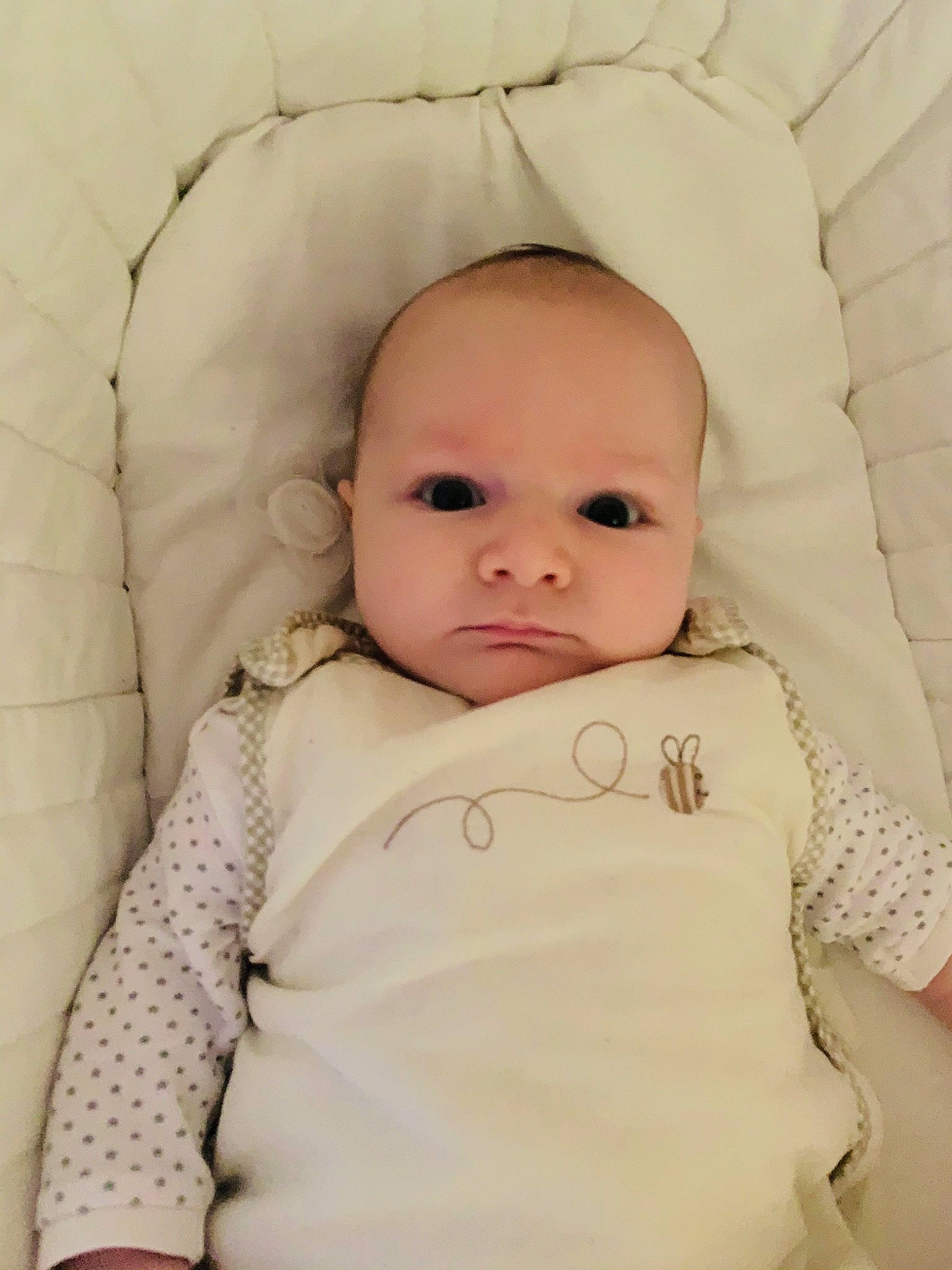 Lacie is registered to the contest to win money with this photo: baby, baby_toddler_clothing, cheek, child, chin, collar, comfort, eye, eyebrow, face, head, iris, linens, lip, mouth, neck, nose, person, skin, sleeve