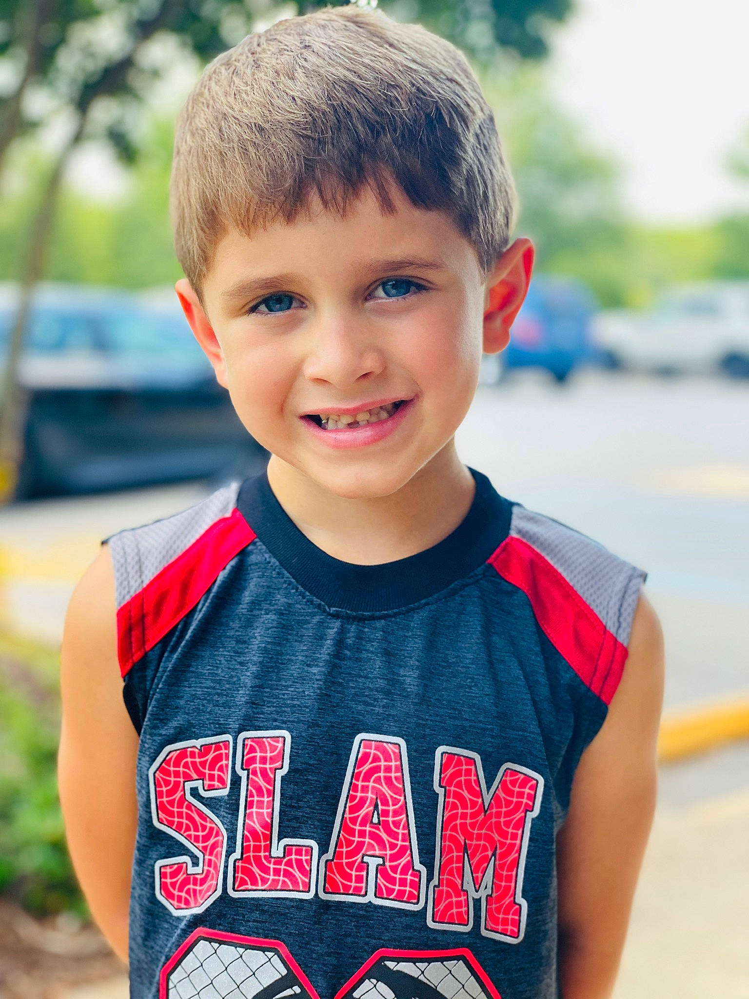 Sawyer is registered to the contest to win money with this photo: clothing, cool, electric_blue, eye, eyebrow, face, fun, hair, happy, head, jersey, joy, leisure, neck, person, red, sleeve, smile, summer, t_shirt