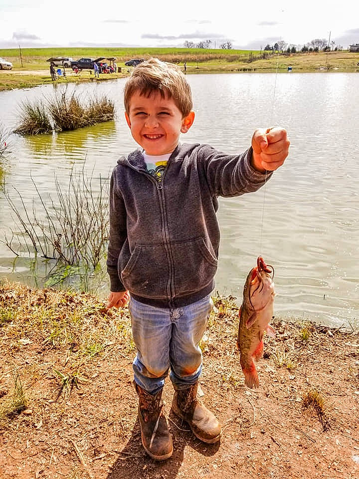 Sawyer joined the competition — help win amazing prizes! bank, boot, child, fish, fun, grass, grass_family, happy, jacket, joy, lake, landscape, people_in_nature, person, plant, recreation, shore, sky, smile, toddler