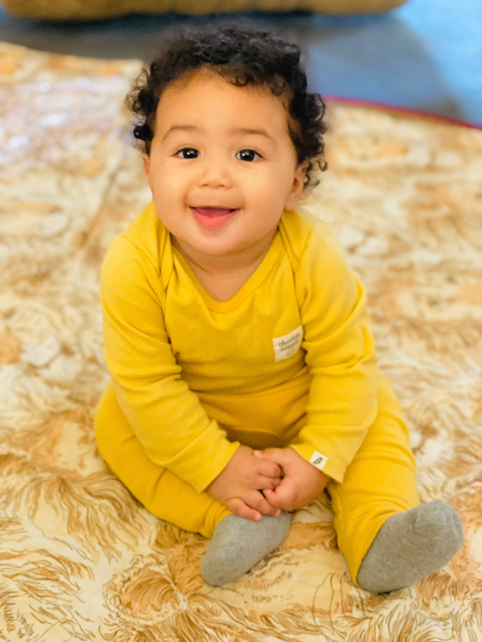 Jahkarri is registered to the contest to win money with this photo: baby, baby_toddler_clothing, cheek, face, facial_expression, floor, flooring, fun, grass, hairstyle, happy, head, joy, nose, people_in_nature, person, skin, sleeve, smile, toddler