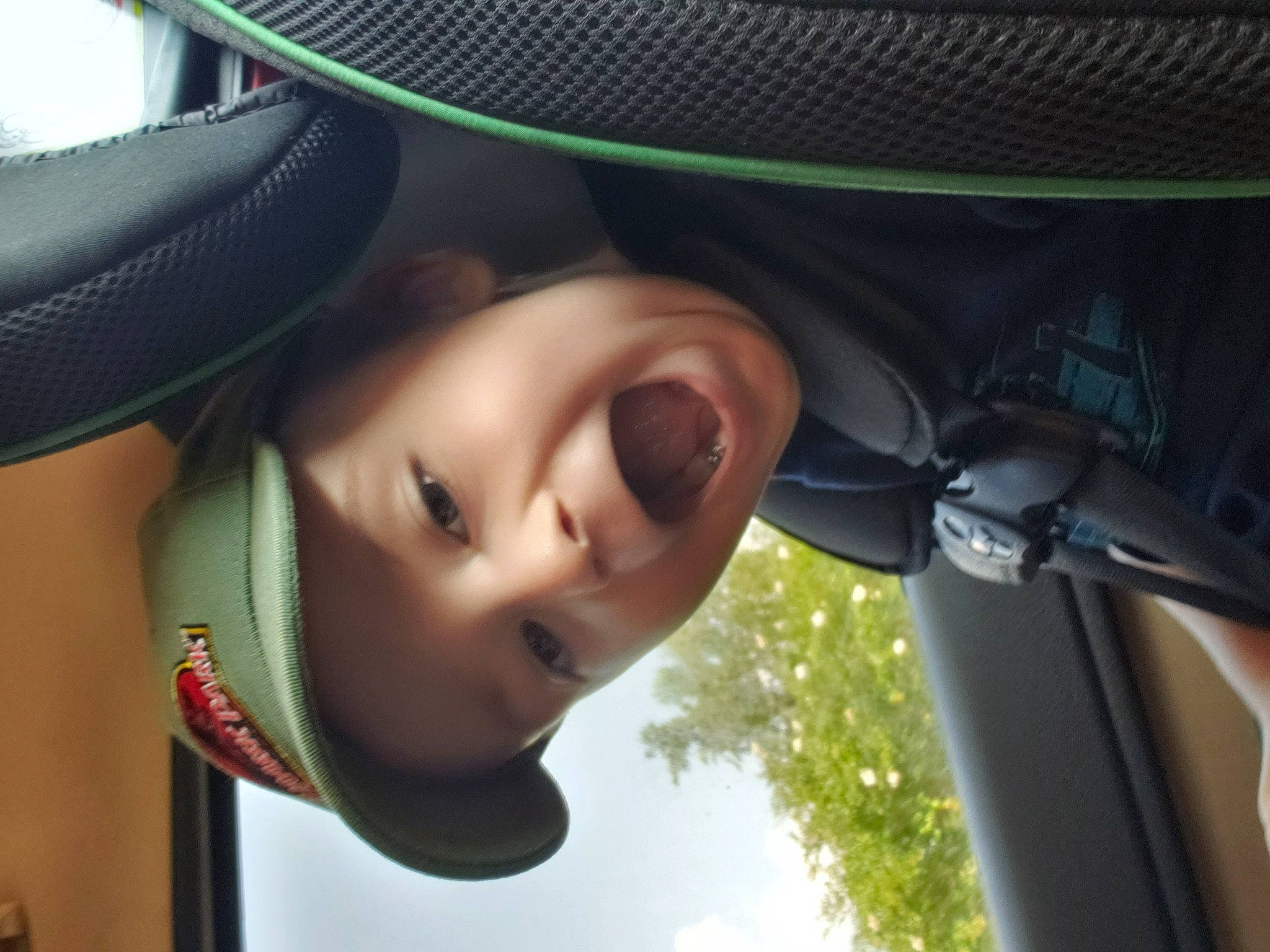 Damian joined the competition — help win amazing prizes! audio_equipment, auto_part, automotive_mirror, child, eye, eyelash, fun, grass, happy, headgear, headwear, leisure, light, lip, nose, person, plant, smile, toddler, tree