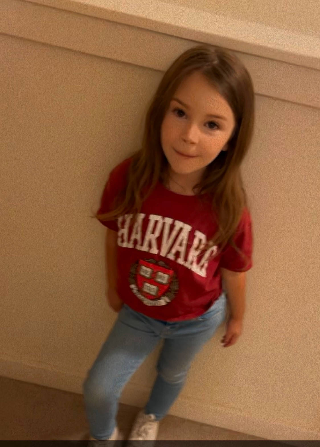 Paisley is registered to the contest to win money with this photo: arm, clothing, denim, floor, flooring, fun, happy, jeans, knee, leg, lip, person, shoulder, skin, sleeve, sportswear, standing, t_shirt, thigh, trunk