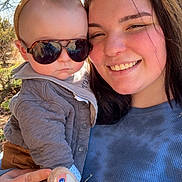 Jericho joined the competition — help win amazing prizes! baby, child, woman, sunglasses, bunny_ears, outdoor, smile, person, face, clothing, jacket, nature, tree, sunlight, hand, headwear, cute, portrait, holding, happy