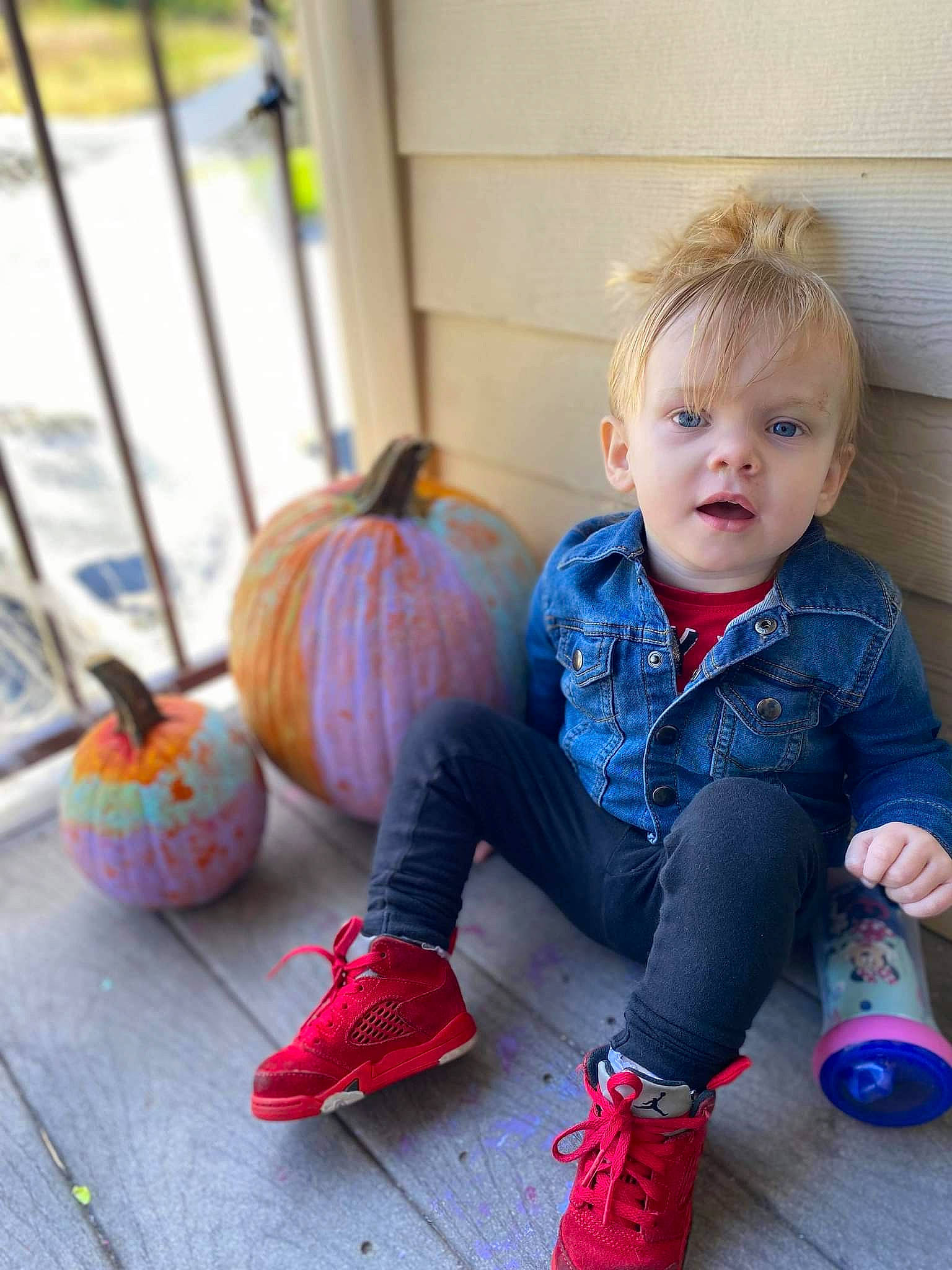 Kenleigh is registered to the contest to win money with this photo: baby_toddler_clothing, calabaza, child, cucurbita, dress, face, flooring, gourd, happy, head, knee, leg, natural_foods, orange, person, pumpkin, shoe, squash, toddler, winter_squash