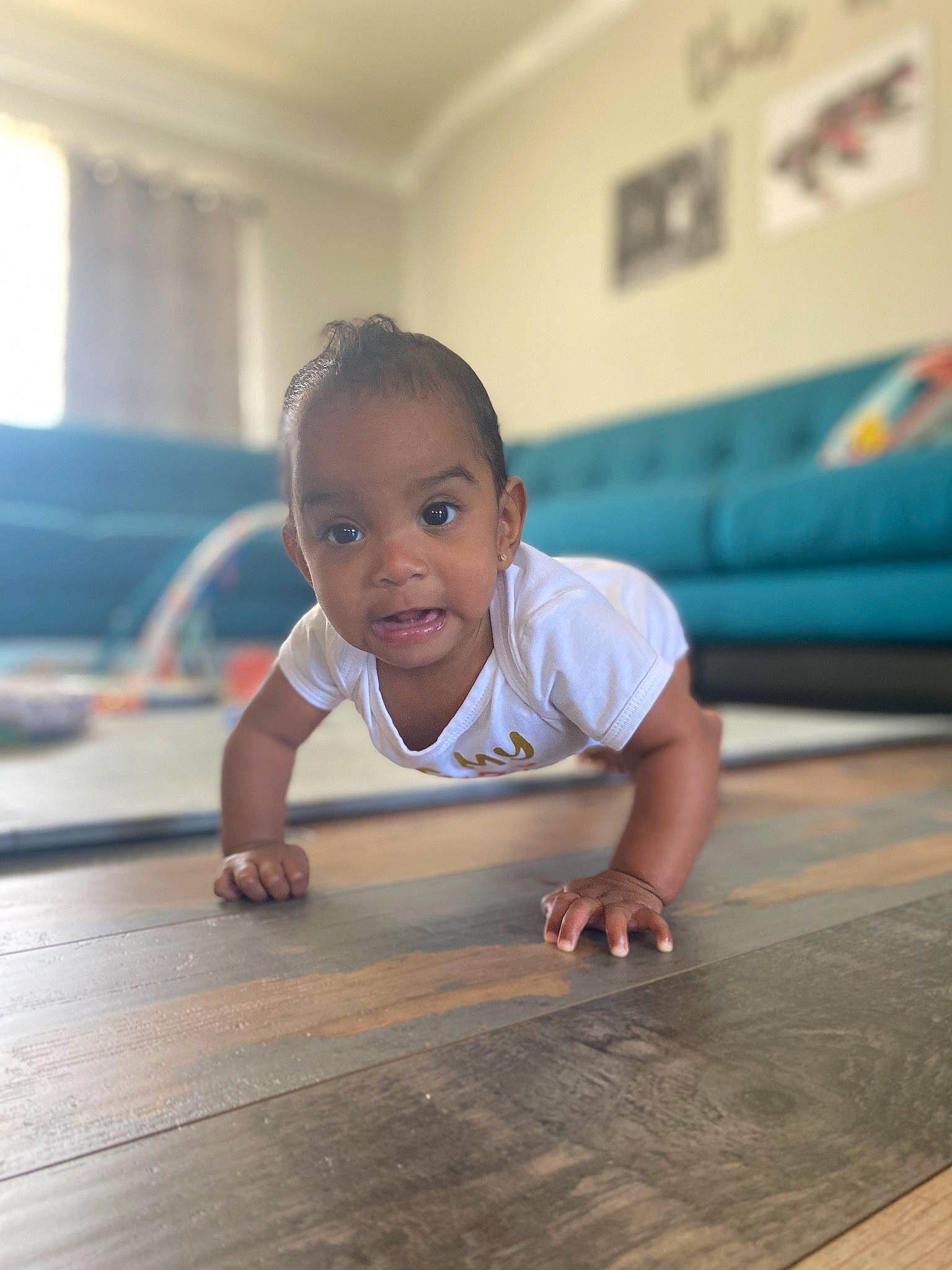 Aila joined the competition — help win amazing prizes! baby_toddler_clothing, child, crawling, floor, flooring, foot, fun, happy, hardwood, laminate_flooring, leisure, person, sitting, skin, smile, t_shirt, toddler, varnish, wood, wood_flooring