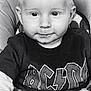 Myronn a rejoint le concours — aidez-le/la à gagner de superbes lots ! baby, child, face, drool, shirt, text, acdc, clothing, cushion, seat, smile, black_and_white, portrait, young_child, sitting, cute, hair, eyes, long_sleeves, blanket