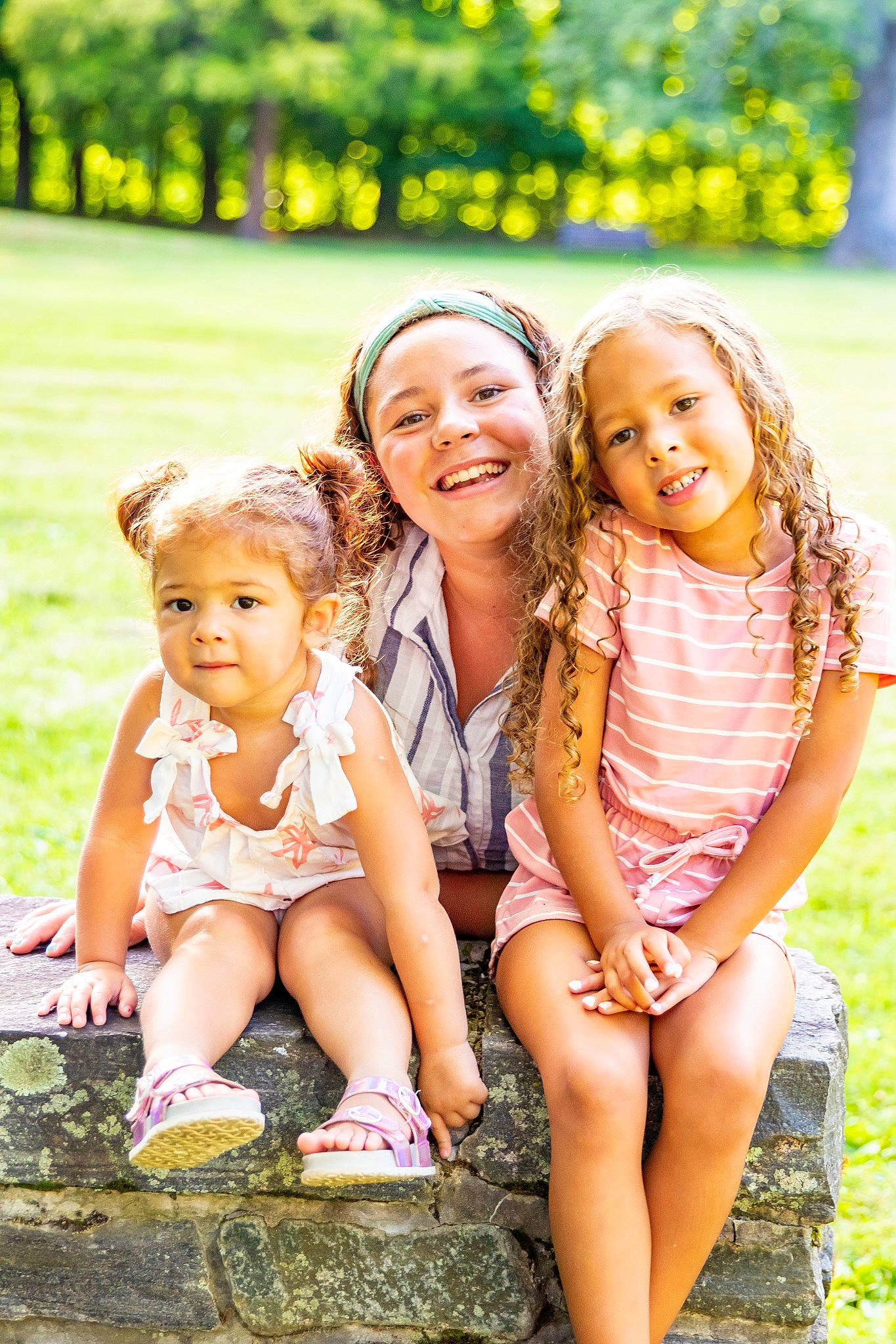 Isley is registered to the contest to win money with this photo: botany, dress, eye, face, facial_expression, flash_photography, grass, happy, headwear, joy, leaf, leg, leisure, nature, people_in_nature, person, photograph, playing_with_kids, skin, smile