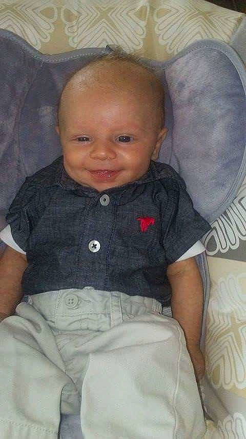 Paxton is registered to the contest to win money with this photo: cheek, child, day, ear, eye, face, forehead, girl, head, human_hair_color, infant, iris, joy, nose, person, product, sitting, skin, smile, toddler