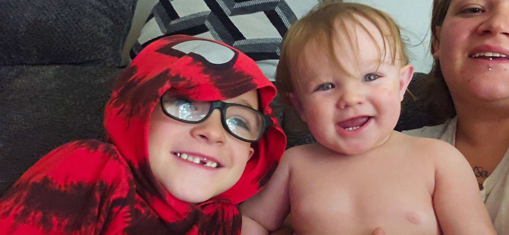 Connor is registered to the contest to win money with this photo: cheek, chin, cool, eyebrow, eyelash, eyewear, fun, gesture, glasses, goggles, happy, headwear, human_body, interaction, joy, lip, mouth, nose, person, skin