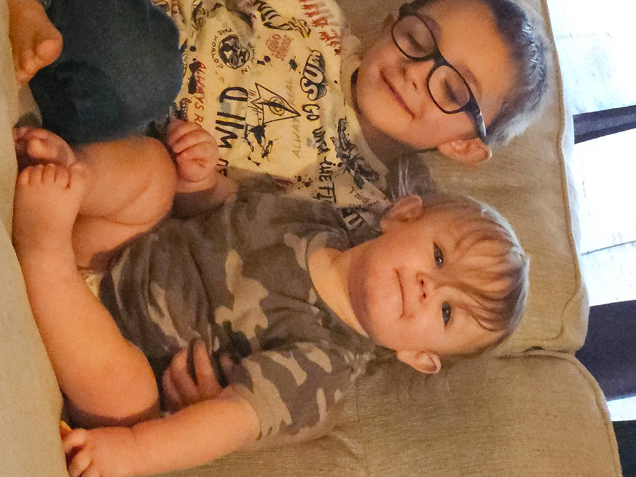 Connor is registered to the contest to win money with this photo: baby, bedtime, cheek, chest, child, comfort, fun, happy, joy, linens, nap, nose, pattern, person, room, sitting, skin, textile, thigh, toddler