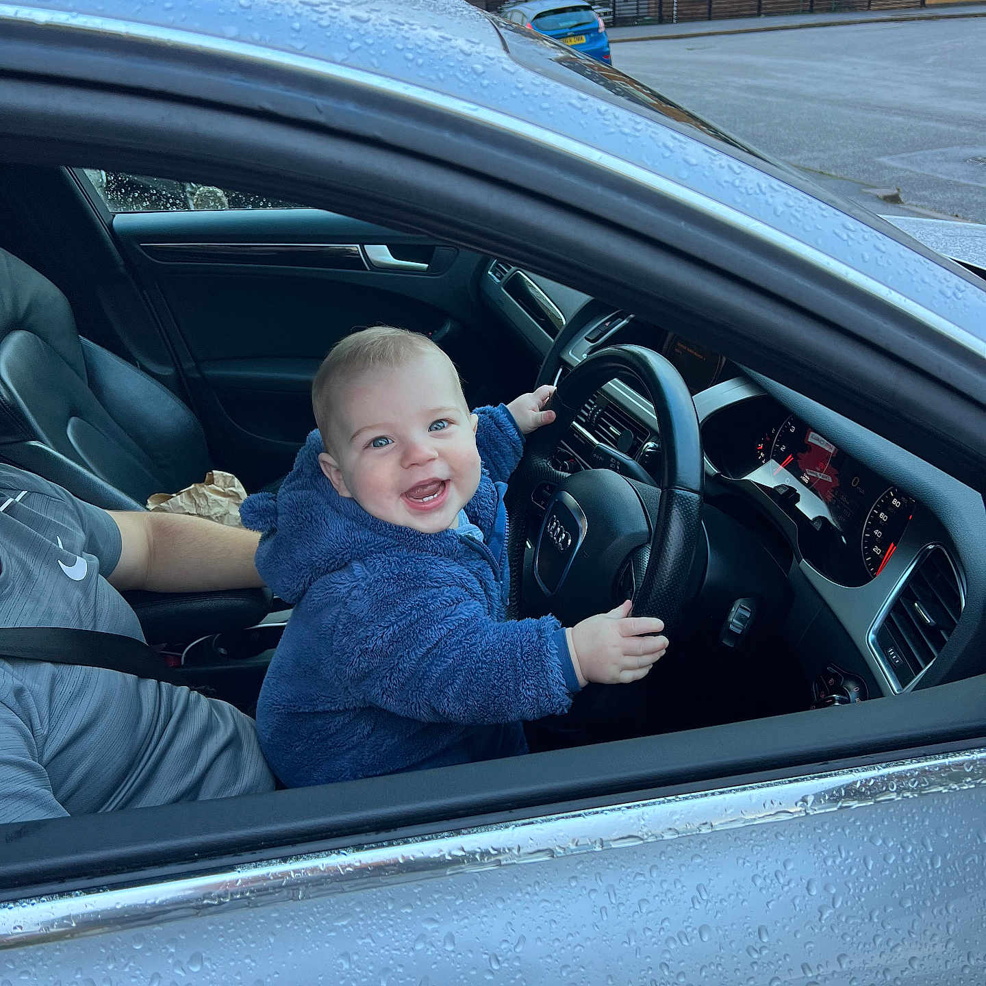 Louie is registered to the contest to win money with this photo: accessories, adult, alloywheel, architecture, baby, bag, belt, bodypart, building, car, car_interior, carseat, carwheel, city, clothing, coat, convertible, coupe, cushion, driving
