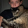 Ruby joined the competition — help win amazing prizes! person, cat, indoor, closeup, fluffy, tabby, pet, animal, snuggling, cozy, sleepy, face, fur, comfort, dim_light, casual, home, relaxed, companion, portrait
