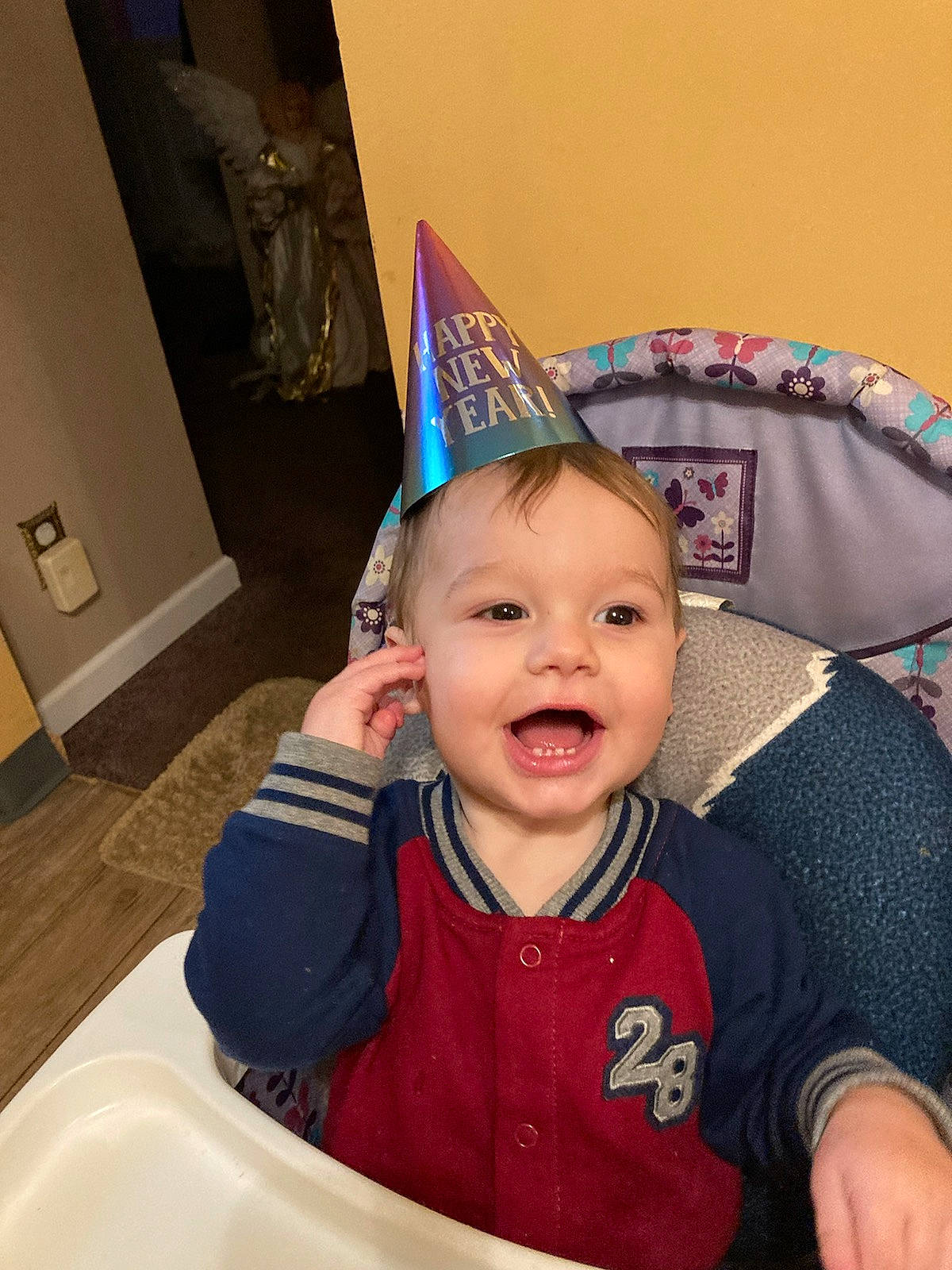 Seth is registered to the contest to win money with this photo: baby, baby_toddler_clothing, birthday, chair, cheek, child, cone, costume, costume_hat, event, fashion_accessory, fun, happy, party_hat, party_supply, person, sleeve, smile, t_shirt, toddler