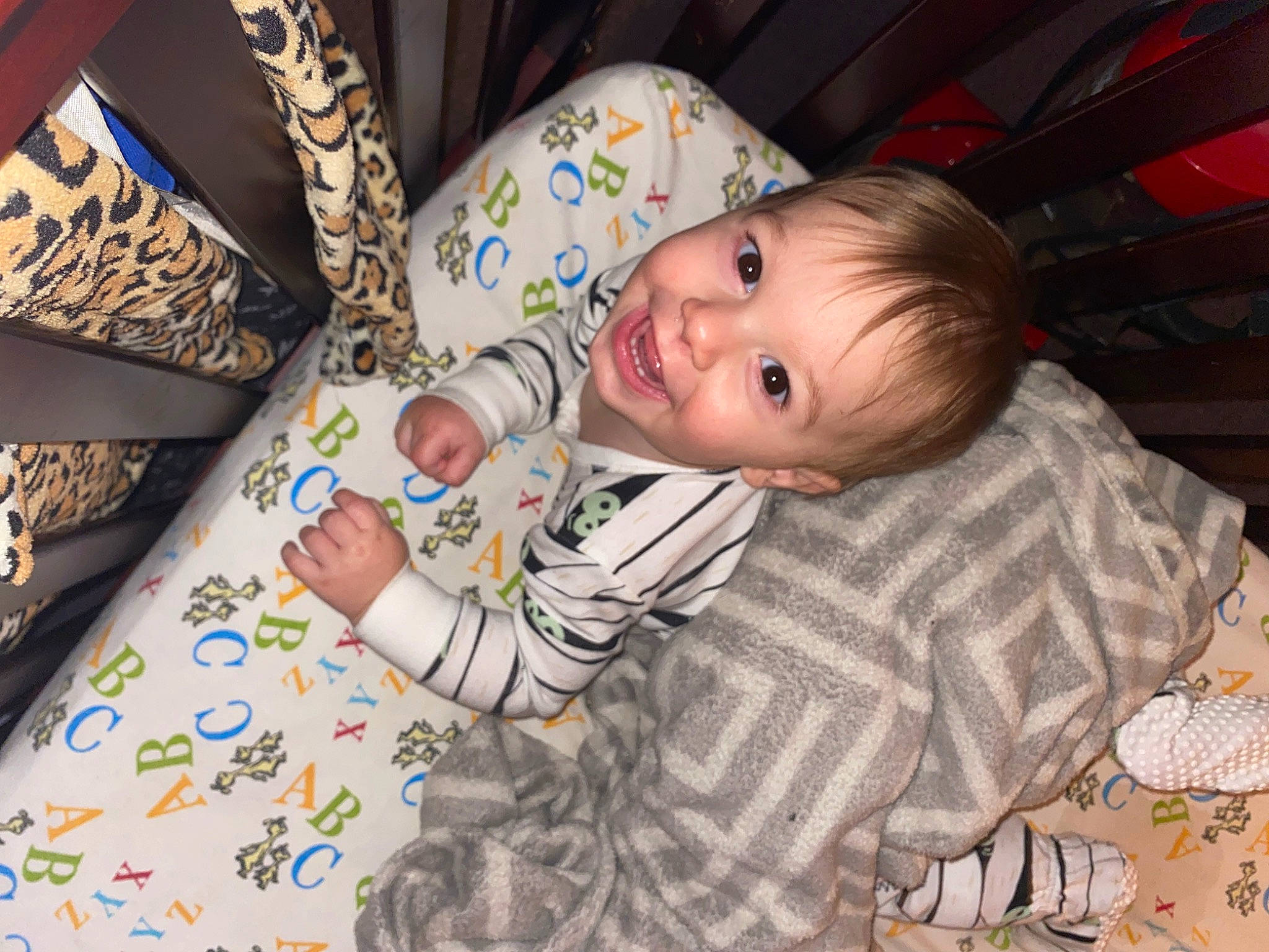 Seth is registered to the contest to win money with this photo: baby, baby_products, baby_toddler_clothing, cheek, child, comfort, finger, fun, happy, linens, mammal, pattern, people, person, sitting, skin, sleeve, smile, textile, toddler