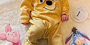 Marius participe au concours pour gagner de l'argent avec cette photo : baby, infant, winnie_the_pooh, onesie, pacifier, blanket, plush_clothing, cartoon_characters, pooh, tigger, piglet, eeyore, cute, sleeping, soft_texture, child, laying_down, nursery, decor, cozy