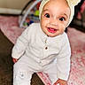 baby, child, smile, headband, pajamas, cozy, indoors, carpet, pink_rug, cute, wide_eyes, happy, sitting, hand, foot, face, portrait, soft_texture, warm_clothing, playful