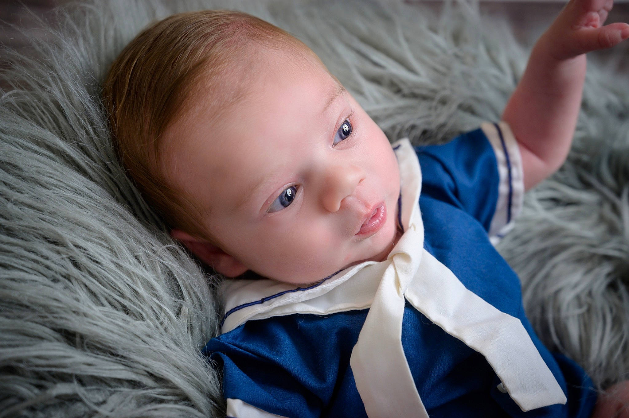 Benji is registered to the contest to win money with this photo: baby, baby_toddler_clothing, blue, cheek, child, close_up, comfort, electric_blue, eye, flash_photography, grass, happy, iris, lip, nose, outerwear, person, skin, sleeve, toddler