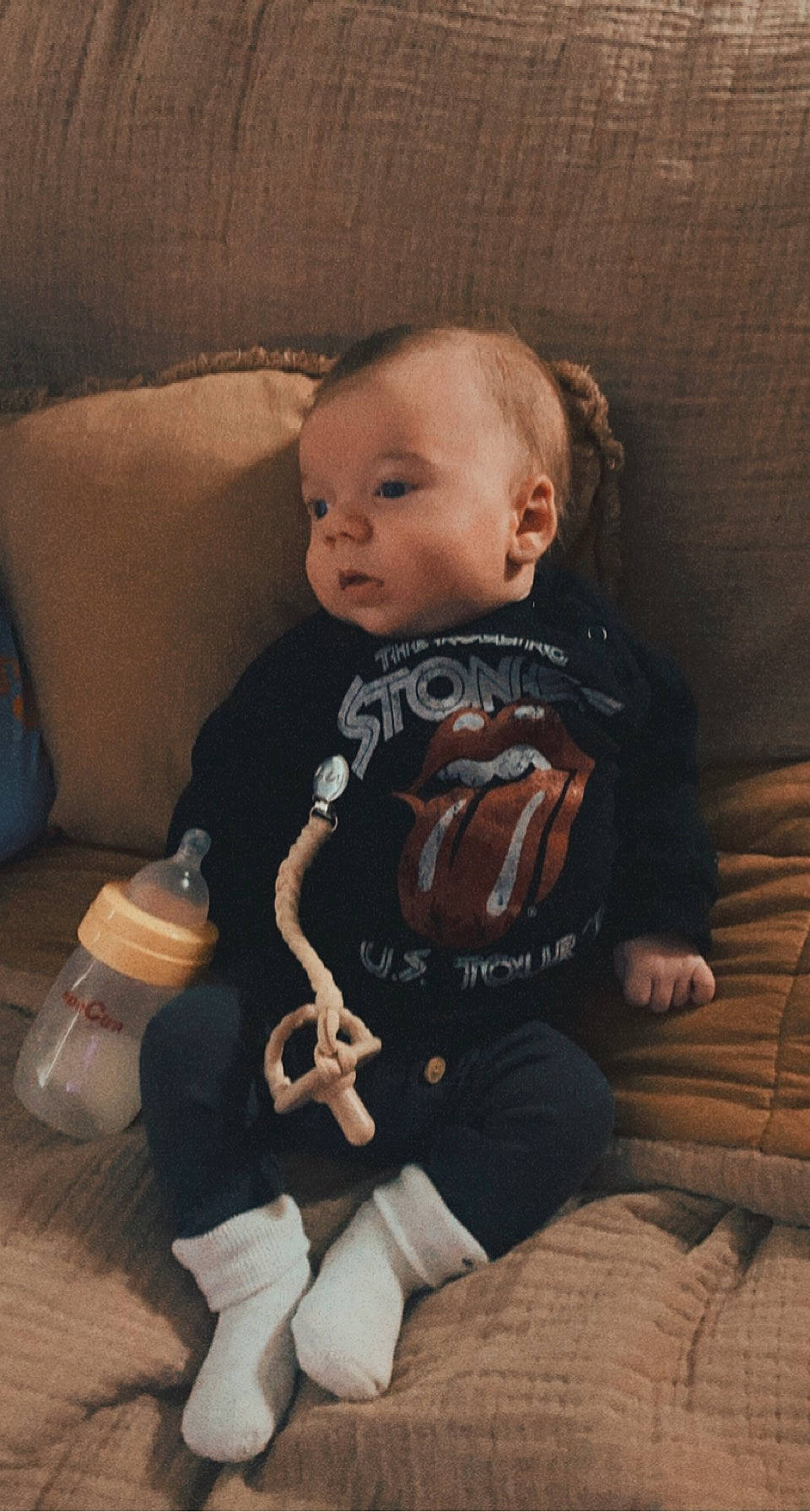 Benji is registered to the contest to win money with this photo: baby, baby_toddler_clothing, bottle, cheek, child, comfort, couch, finger, flash_photography, fun, iris, lap, nose, person, sitting, skin, sleeve, thigh, tints_and_shades, toddler