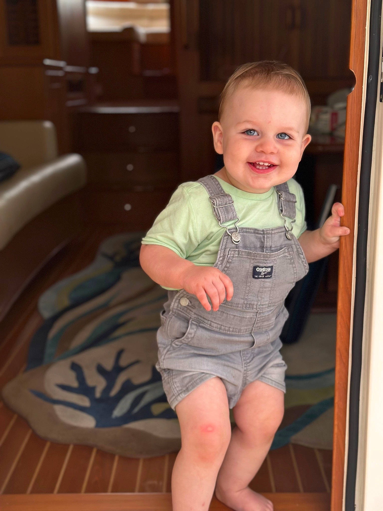Beckham is registered to the contest to win money with this photo: baby, baby_toddler_clothing, cheek, child, floor, flooring, fun, happy, human_leg, iris, joy, leg, person, shoulder, skin, sleeve, smile, t_shirt, thigh, toddler