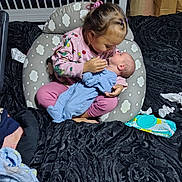 Ryker joined the competition — help win amazing prizes! child, baby, pajamas, cushion, blanket, newborn, infant, bedroom, baby_wipes, tissues, cradle, pink_clothing, blue_clothing, floor, hair_tie, holding, sitting, indoor, toddler, love