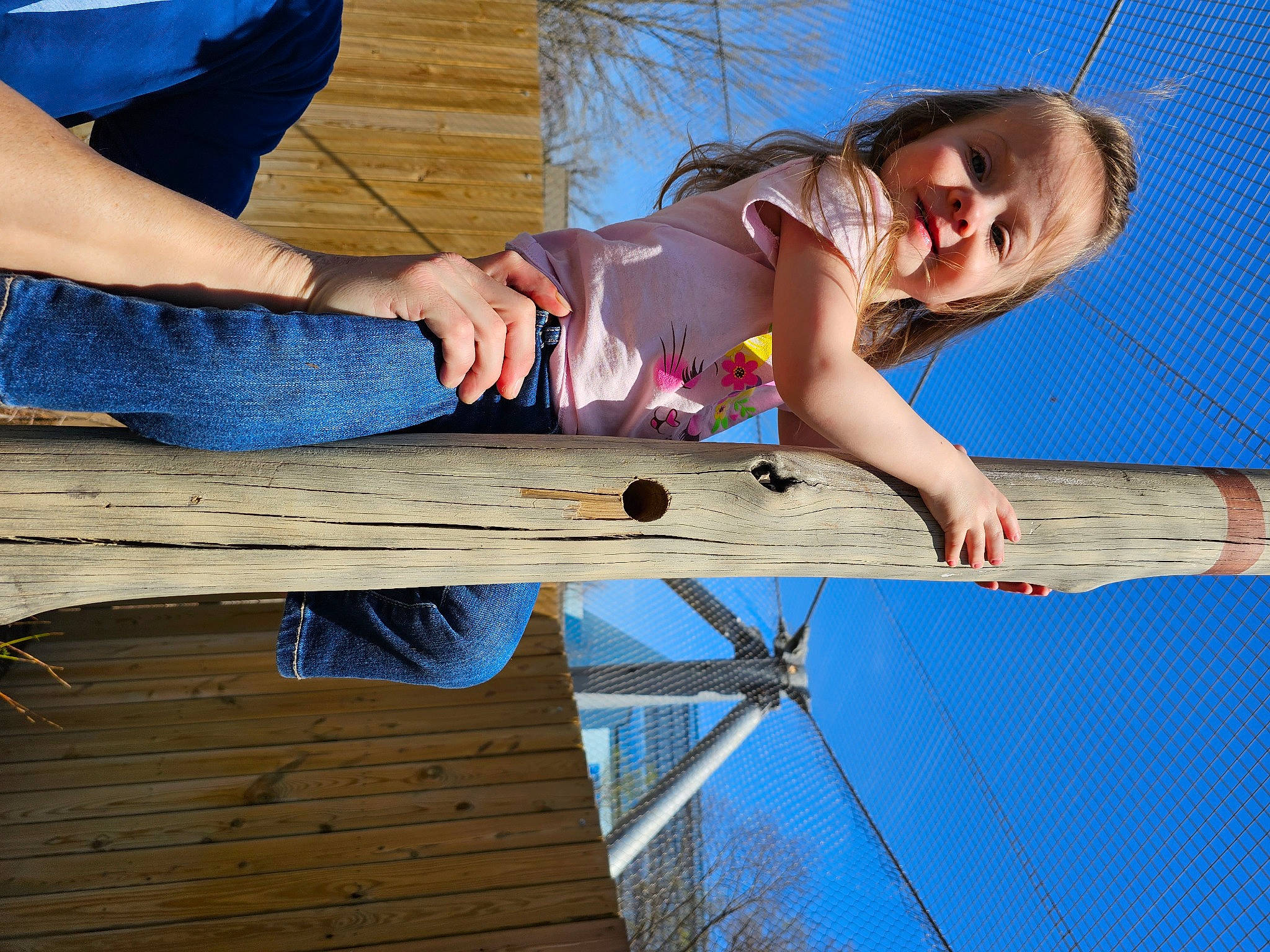 Serenity is registered to the contest to win money with this photo: arm, blue, clothing, elbow, electric_blue, fun, happy, human_leg, knee, leisure, people_in_nature, person, recreation, sitting, sky, smile, t_shirt, thigh, tree, waist