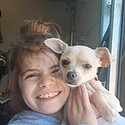 Noodles joined the competition — help win amazing prizes! child, dog, smiling, happy, face, person, pet, indoor, casual, holding, cute, young, light, closeup, expression, animal, friendship, warm, hair, cozy