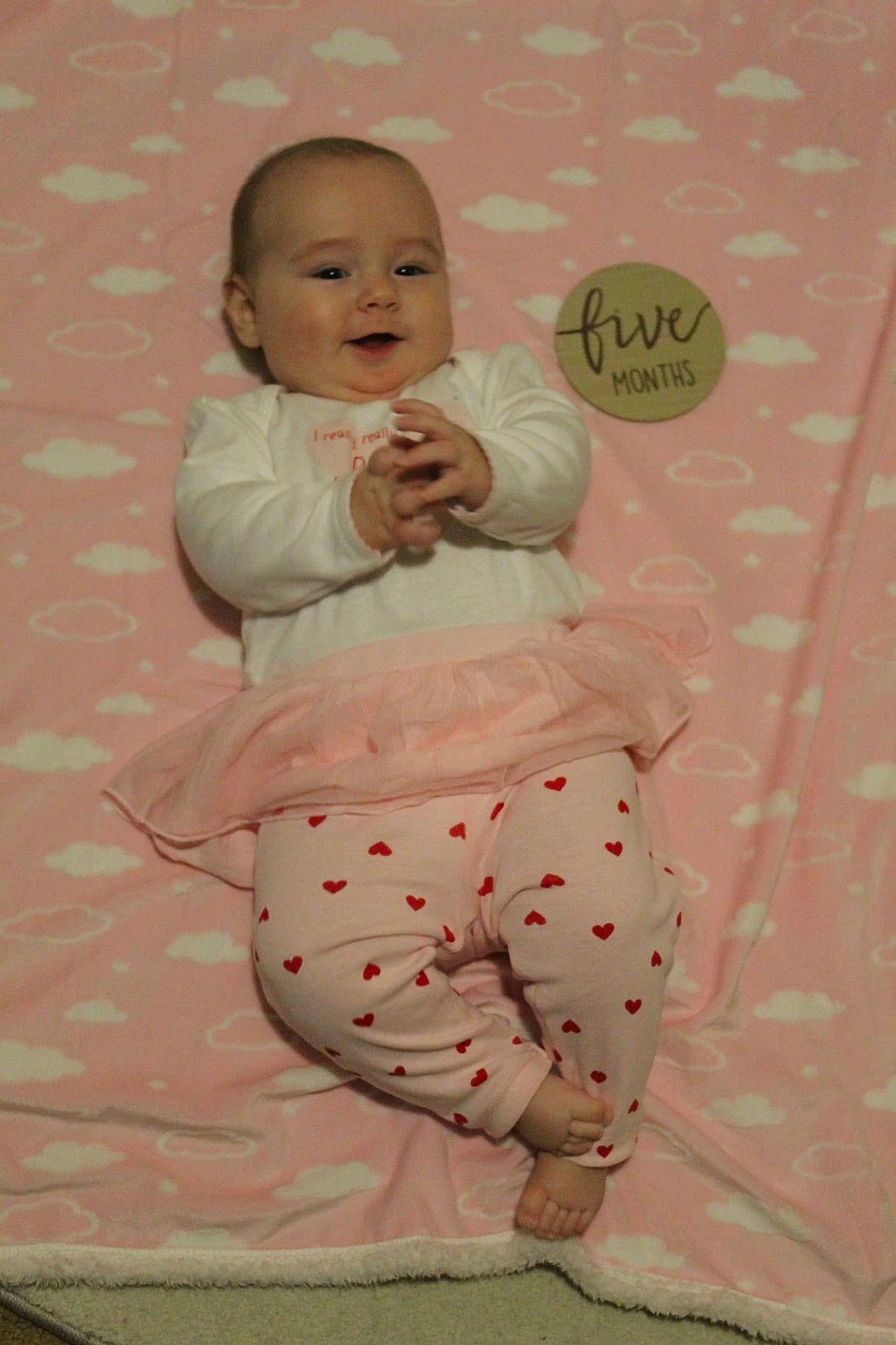 Agnes joined the competition — help win amazing prizes! arm, art, baby, baby_toddler_clothing, cheek, child, comfort, happy, linens, magenta, pattern, peach, person, pink, product, room, sitting, sleeve, smile, t_shirt