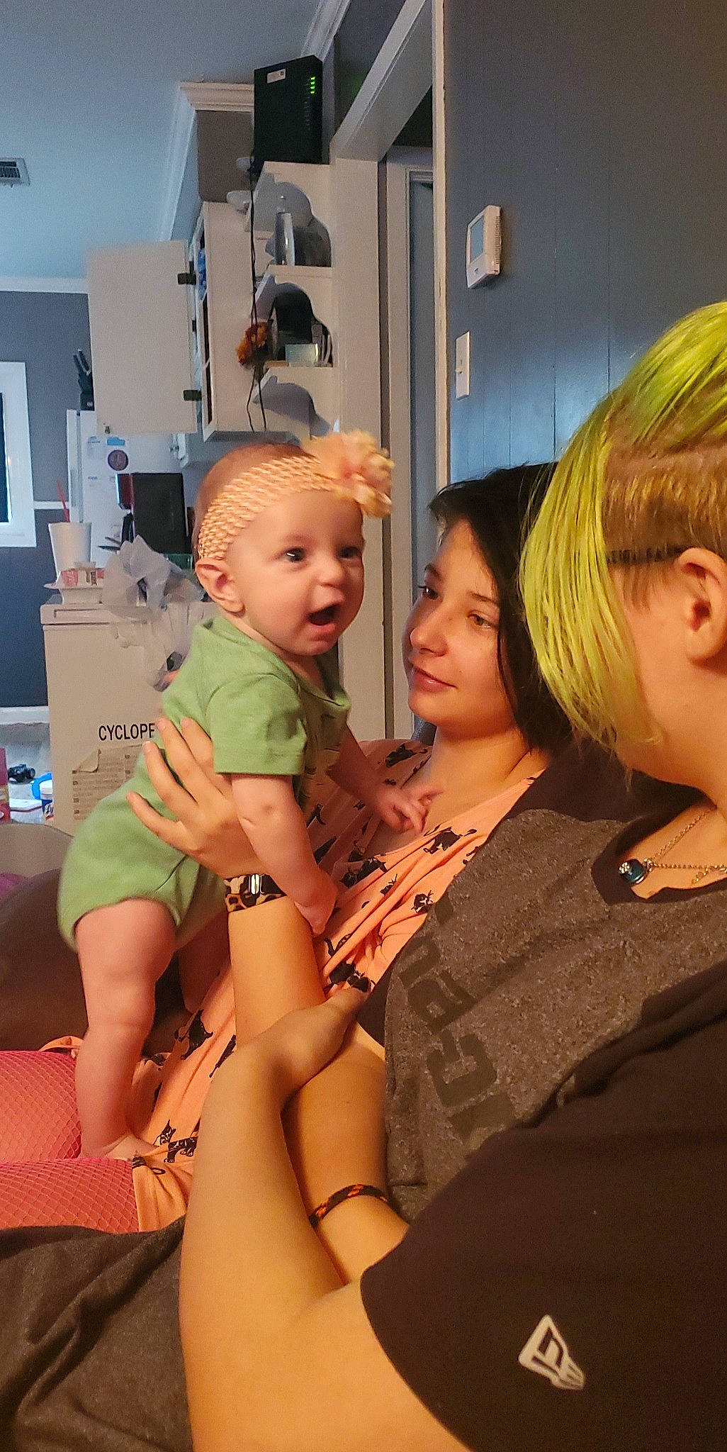 Khloe is registered to the contest to win money with this photo: abdomen, baby, blond, comfort, event, fashion_design, fun, human_leg, jewellery, joy, knee, lap, layered_hair, person, room, shoulder, sitting, skin, thigh, thumb