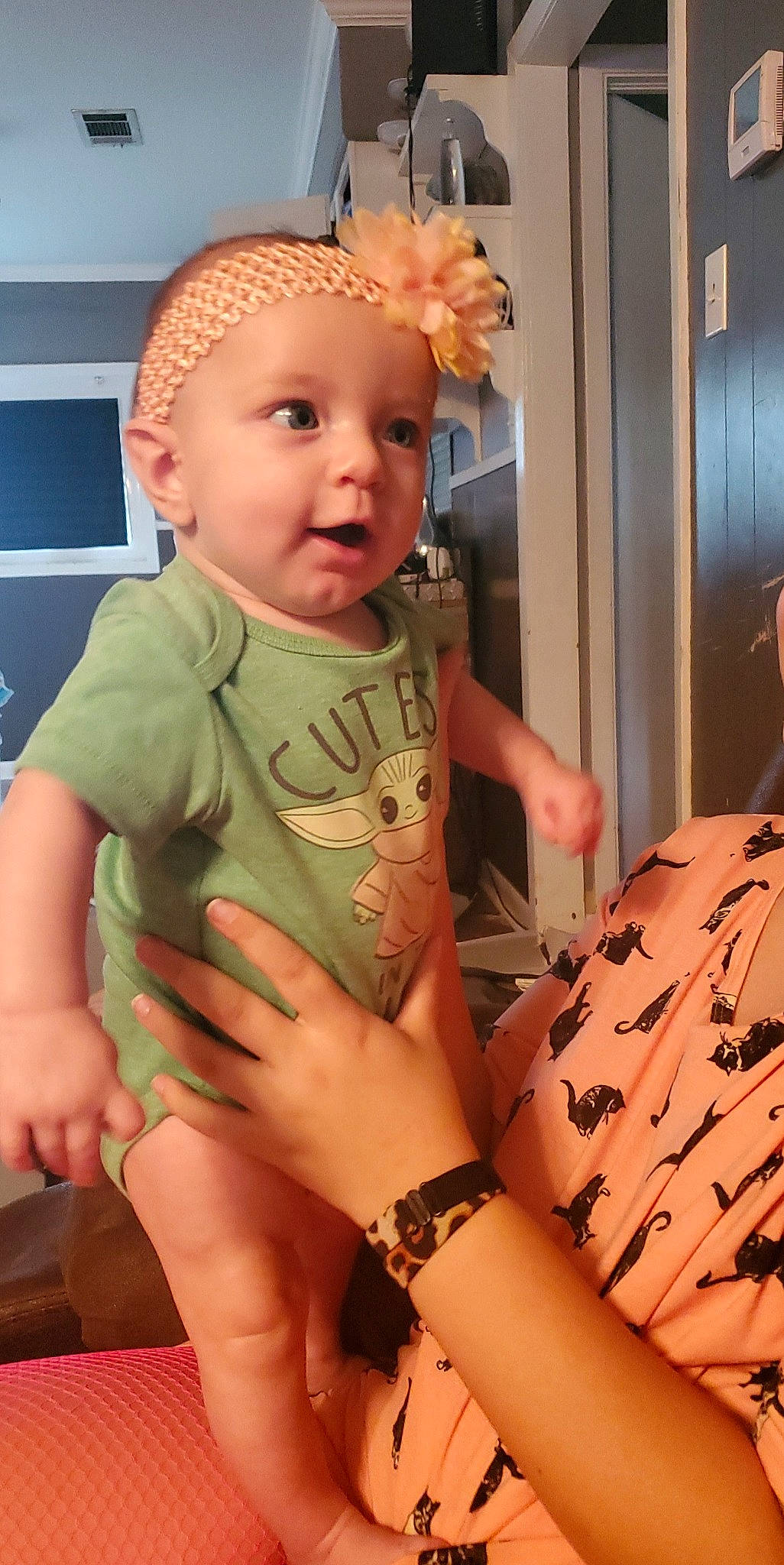 Khloe is registered to the contest to win money with this photo: arm, baby, baby_toddler_clothing, cheek, comfort, finger, gesture, hand, human_body, joint, mouth, muscle, neck, person, pink, shoulder, skin, thigh, thumb, toddler