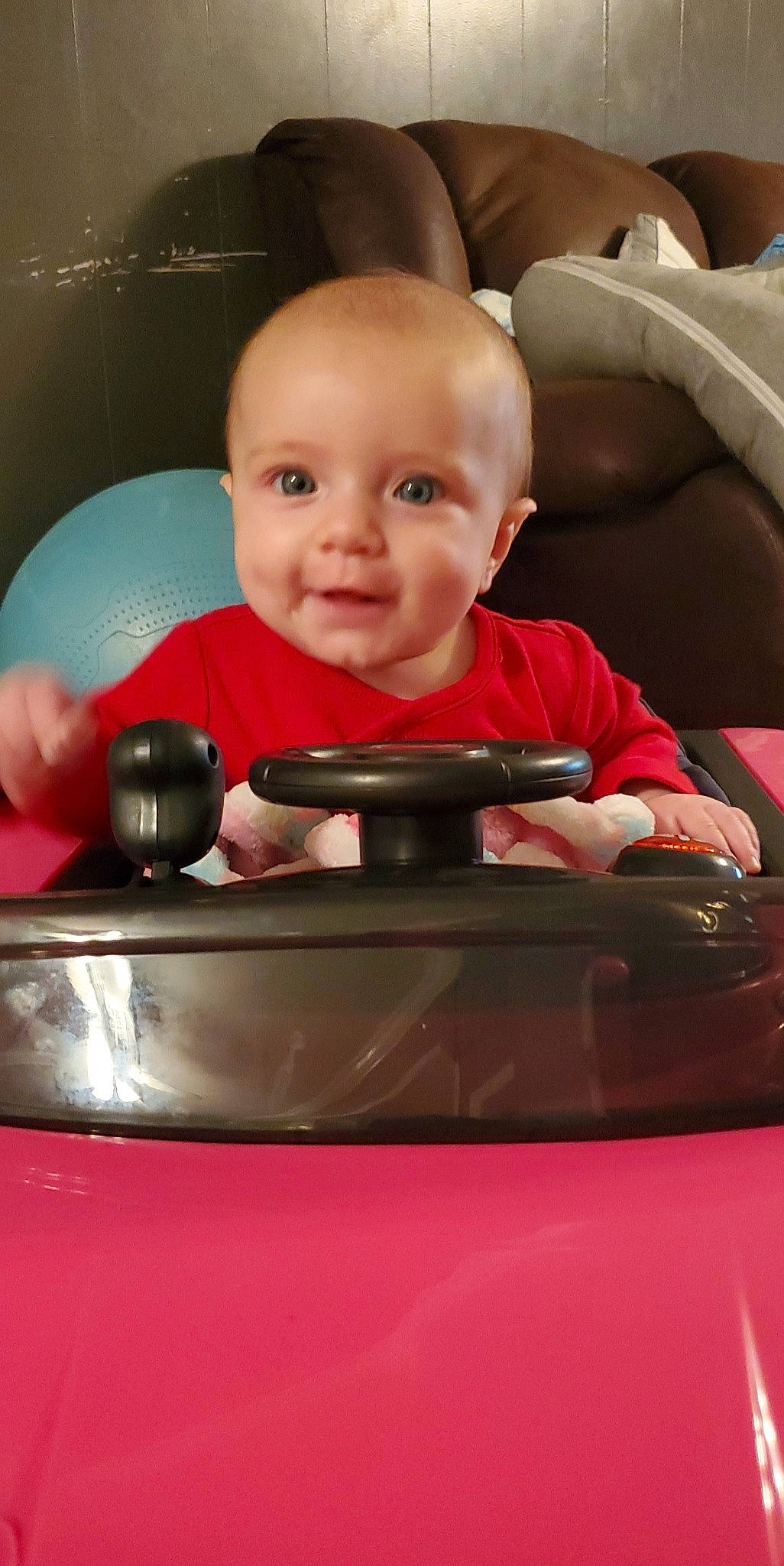 Khloe joined the competition — help win amazing prizes! arm, automotive_design, automotive_exterior, automotive_lighting, baby, cheek, child, comfort, facial_expression, finger, fun, hand, hood, motor_vehicle, mouth, muscle, person, smile, toddler, toy