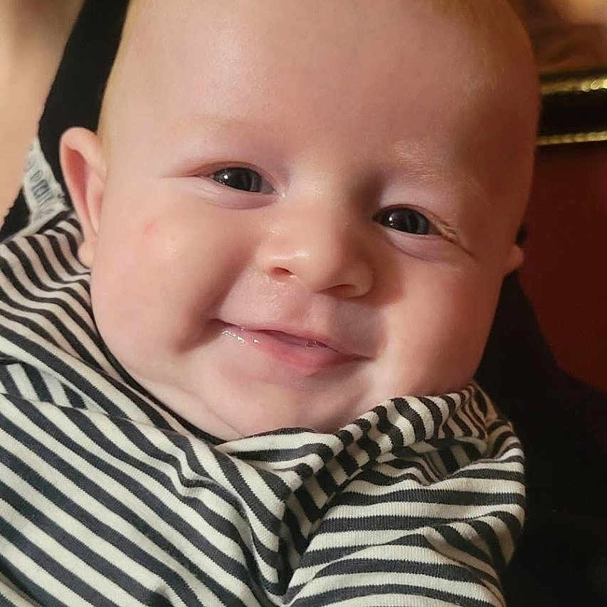 Tucker joined the competition — help win amazing prizes! baby, black_and_white, cheeks, child, closeup, cute, eyes, face, happy, head, human, indoors, infant, mouth, person, portrait, skin, smiling, striped_clothing, young