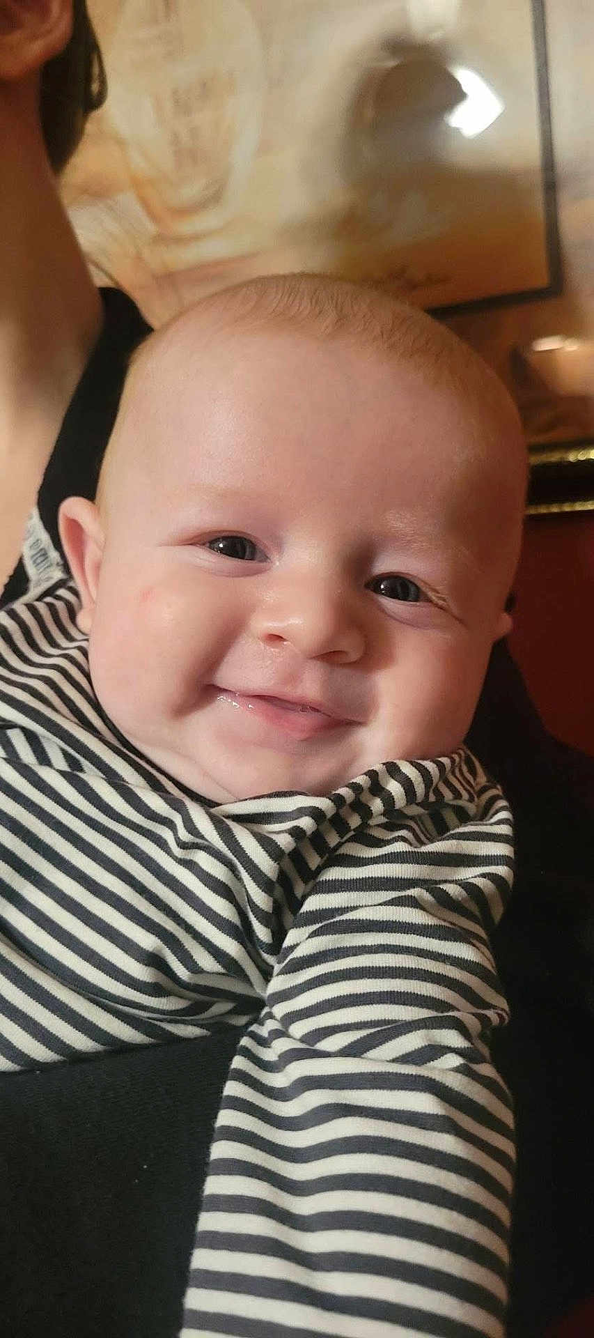 Tucker joined the competition — help win amazing prizes! baby, child, smiling, face, portrait, striped_clothing, person, cute, infant, cheeks, happy, indoors, human, young, black_and_white, closeup, head, eyes, mouth, skin
