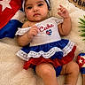 baby, child, cuba, flag, hat, maraca, red_shoes, dress, headband, blanket, cute, infant, portrait, smiling, cultural, indoor, colorful, soft_texture, decor, celebration