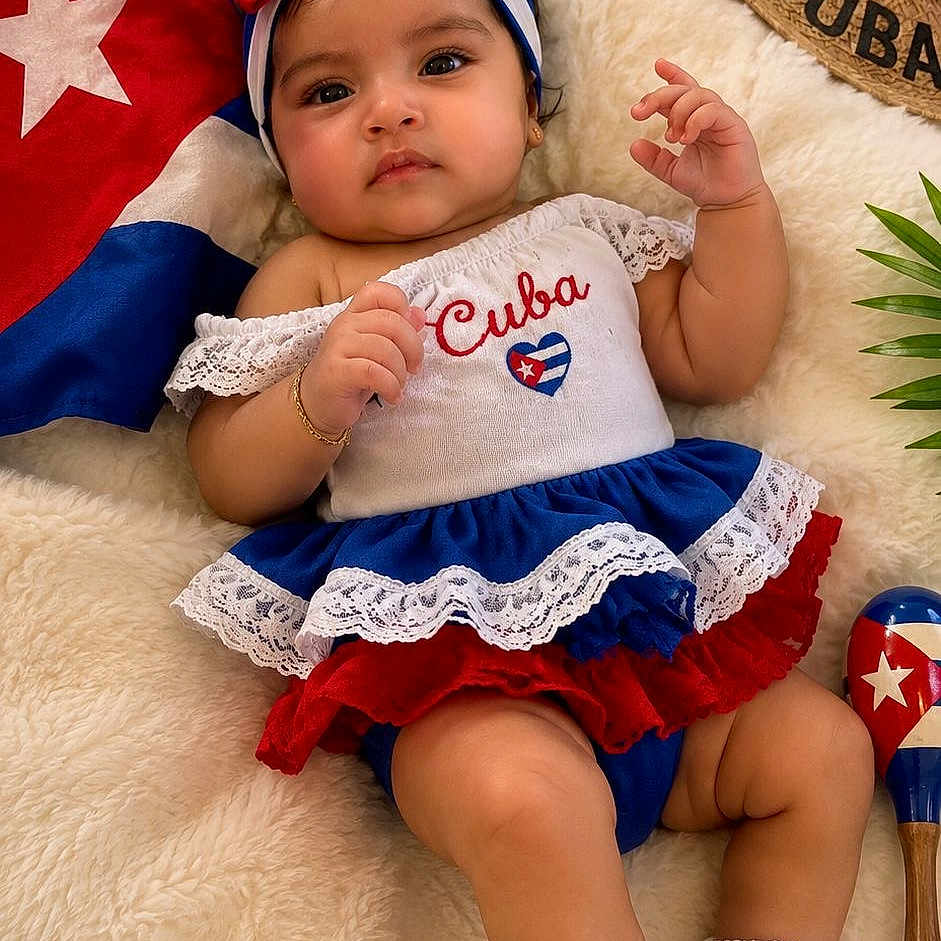 Emma joined the competition — help win amazing prizes! baby, child, cuba, flag, hat, maraca, red_shoes, dress, headband, blanket, cute, infant, portrait, smiling, cultural, indoor, colorful, soft_texture, decor, celebration