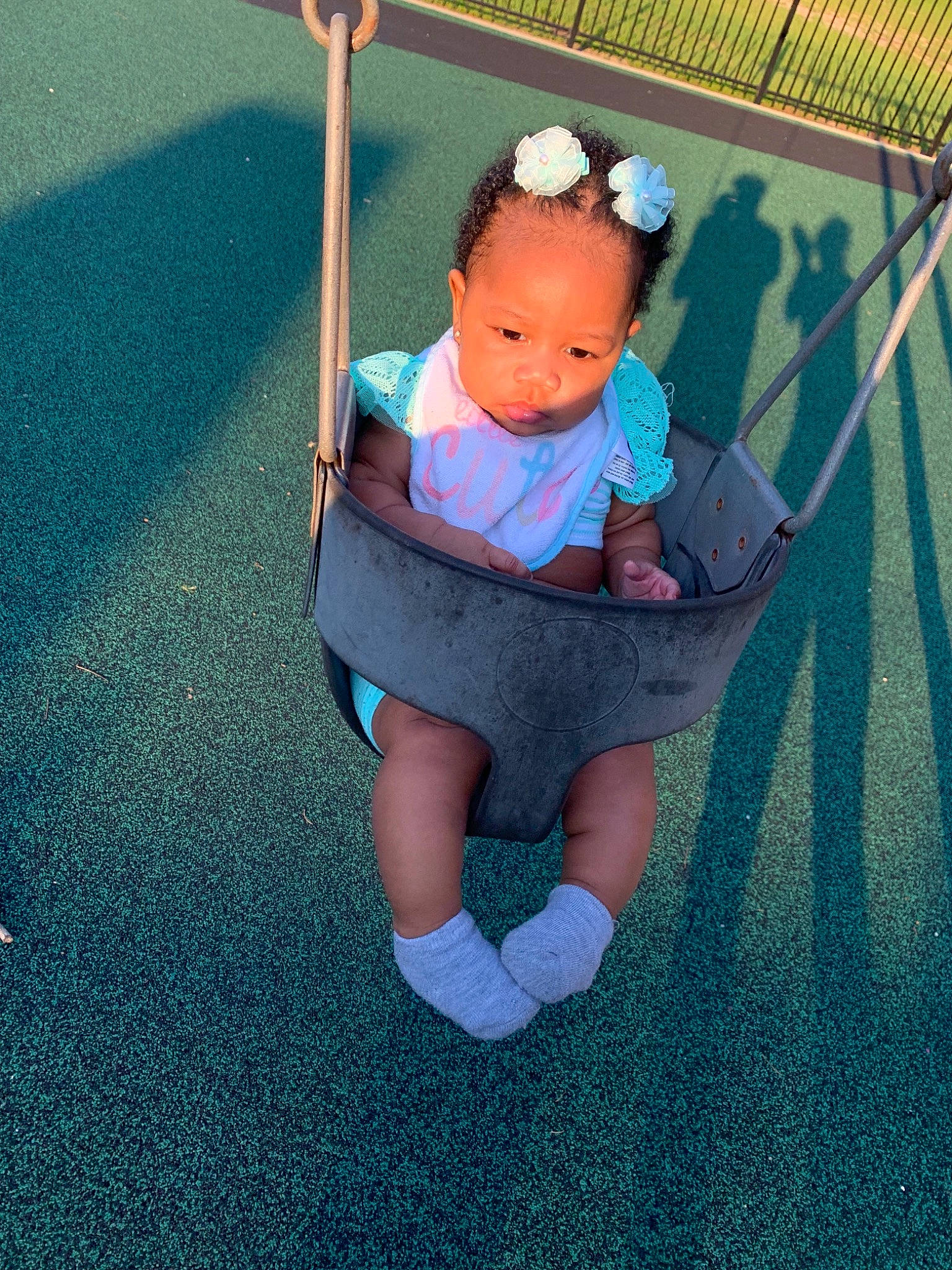 Kenzley joined the competition — help win amazing prizes! baby, baby_products, blue, child, fun, outdoor_play_equipment, person, play, playground, product, public_space, skin, smile, swing, toddler, turquoise