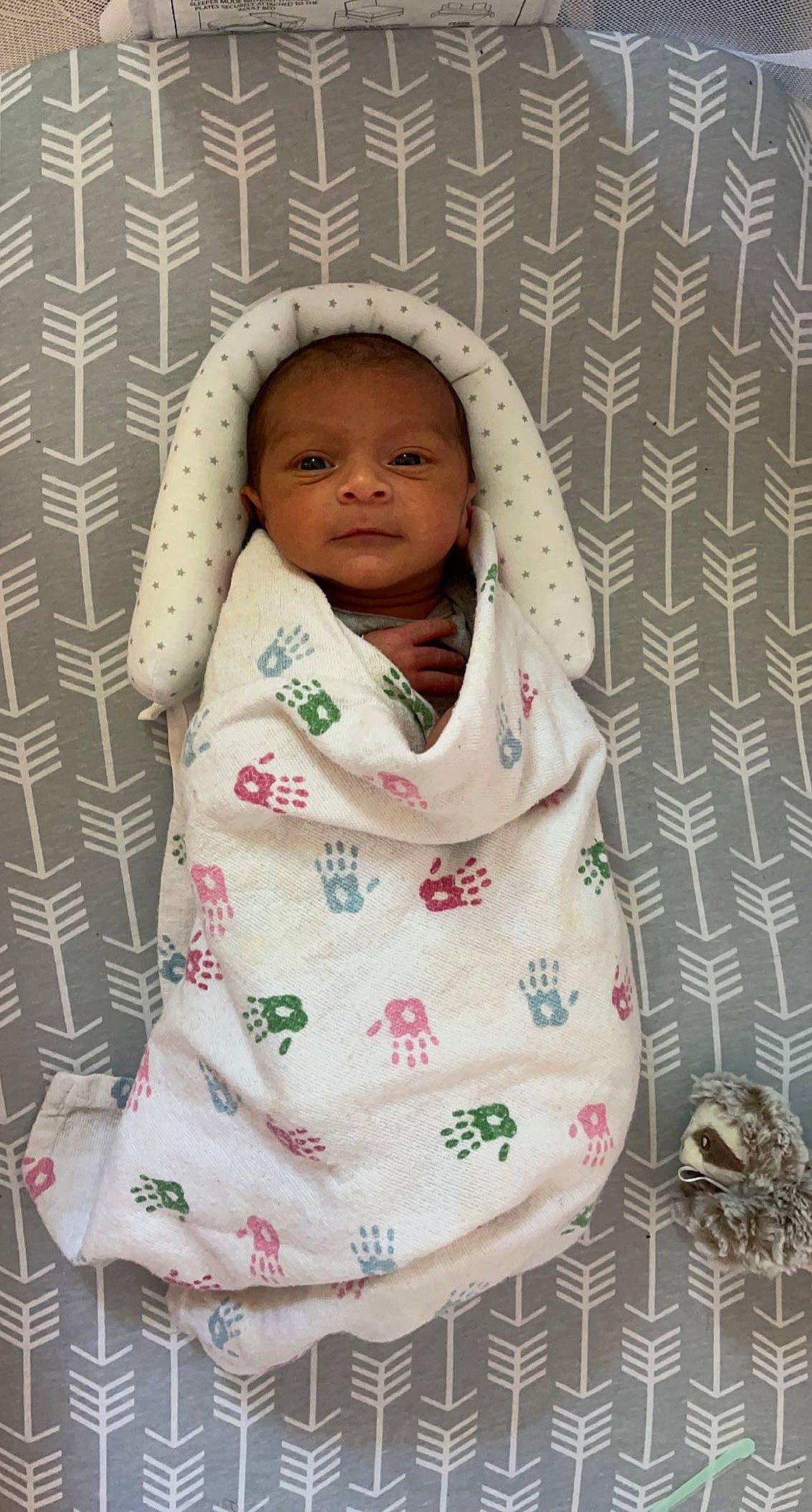 Carlos is registered to the contest to win money with this photo: baby, baby_products, baby_safety, baby_sleeping, baby_toddler_clothing, bedding, cheek, child, comfort, face, happy, infant_bed, linens, outerwear, pattern, person, pink, skin, sleeve, textile