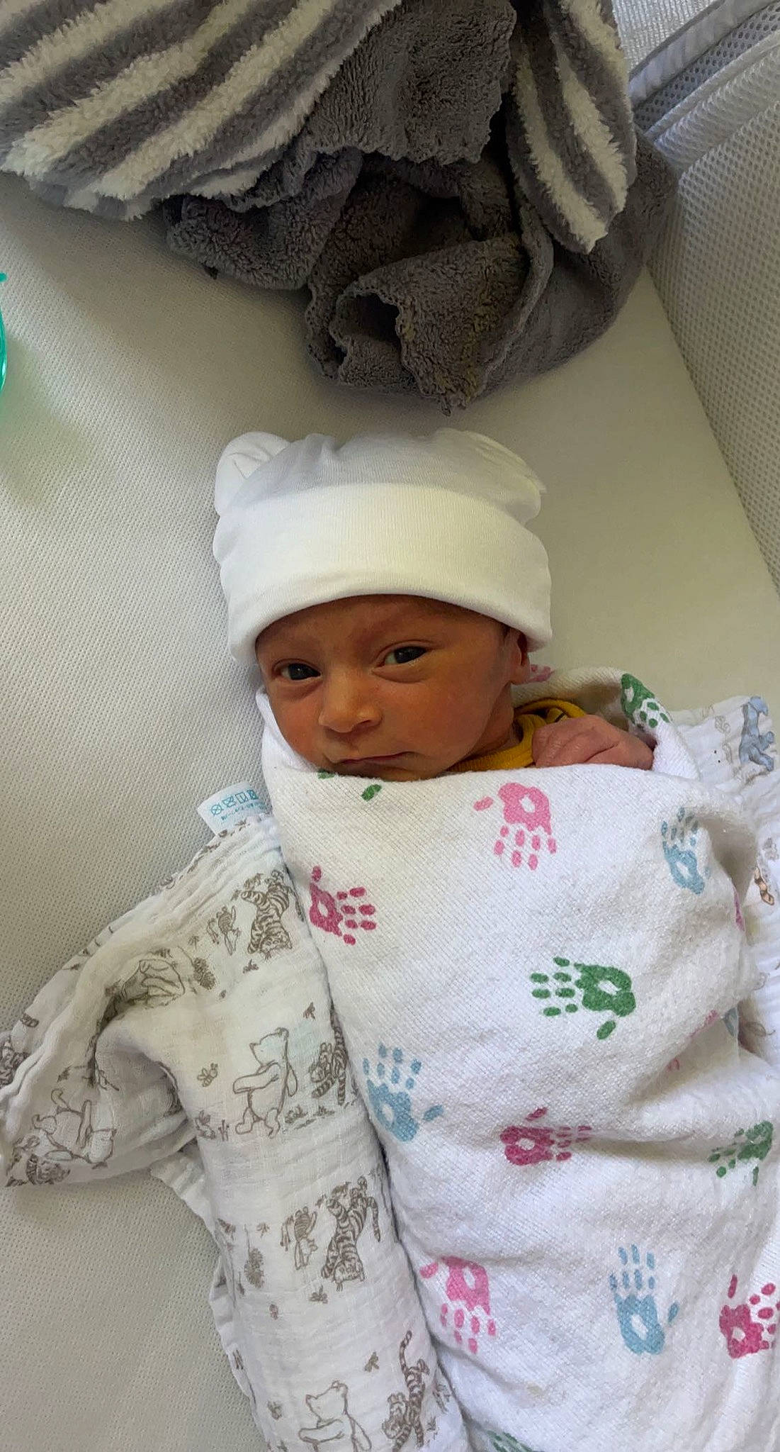 Carlos is registered to the contest to win money with this photo: baby, baby_products, baby_safety, baby_sleeping, baby_toddler_clothing, bedding, cheek, child, comfort, fashion_accessory, headwear, linens, pattern, person, room, skin, sleeve, textile, toddler