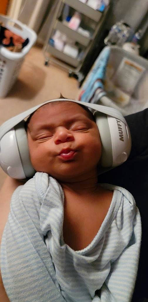 Carlos joined the competition — help win amazing prizes! audio_equipment, baby, baby_toddler_clothing, cheek, child, chin, comfort, ear, electronic_device, eyebrow, eyelash, eyewear, gadget, headphones, headwear, hearing, nose, person, personal_protective_equipment, room