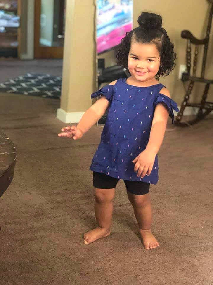 Serenity is registered to the contest to win money with this photo: barefoot, child, clothing, design, joy, leg, pattern, person, shoulder, sleeve, standing, toddler