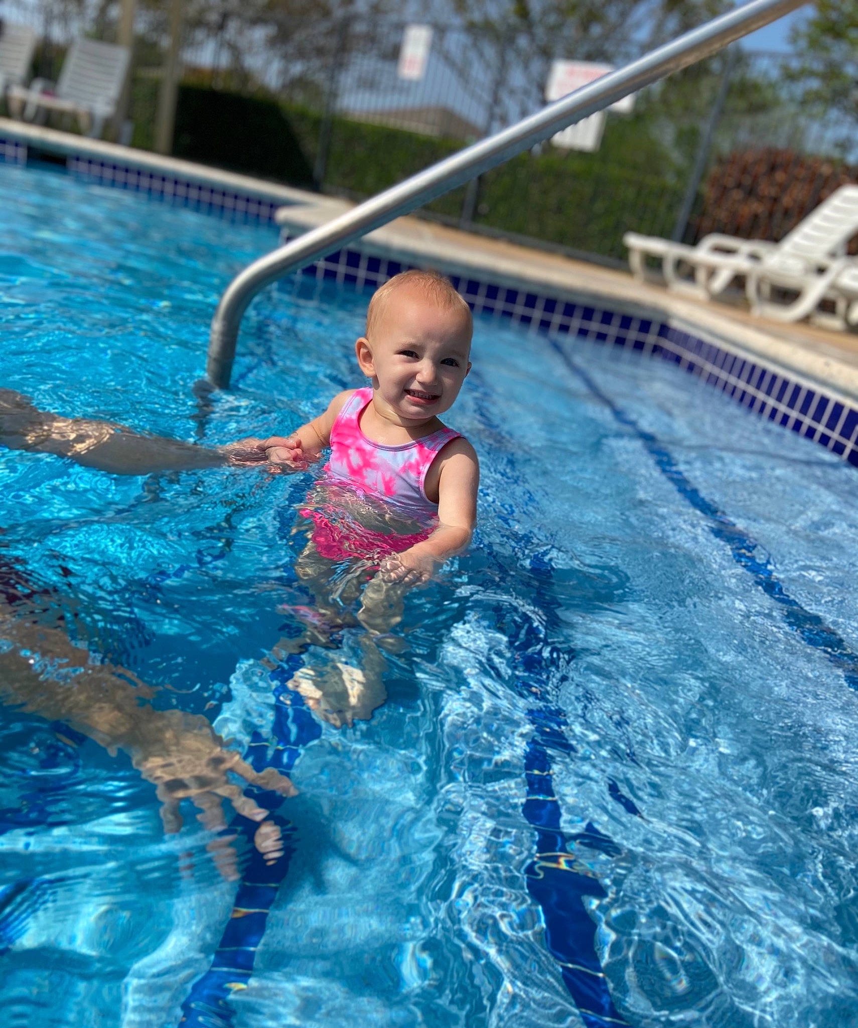 Ayla is registered to the contest to win money with this photo: aqua, azure, baby, bathing, blue, child, electric_blue, fun, happy, joy, leisure, leisure_centre, nonbuilding_structure, outdoor_recreation, person, recreation, smile, swimming_pool, swimwear, toddler