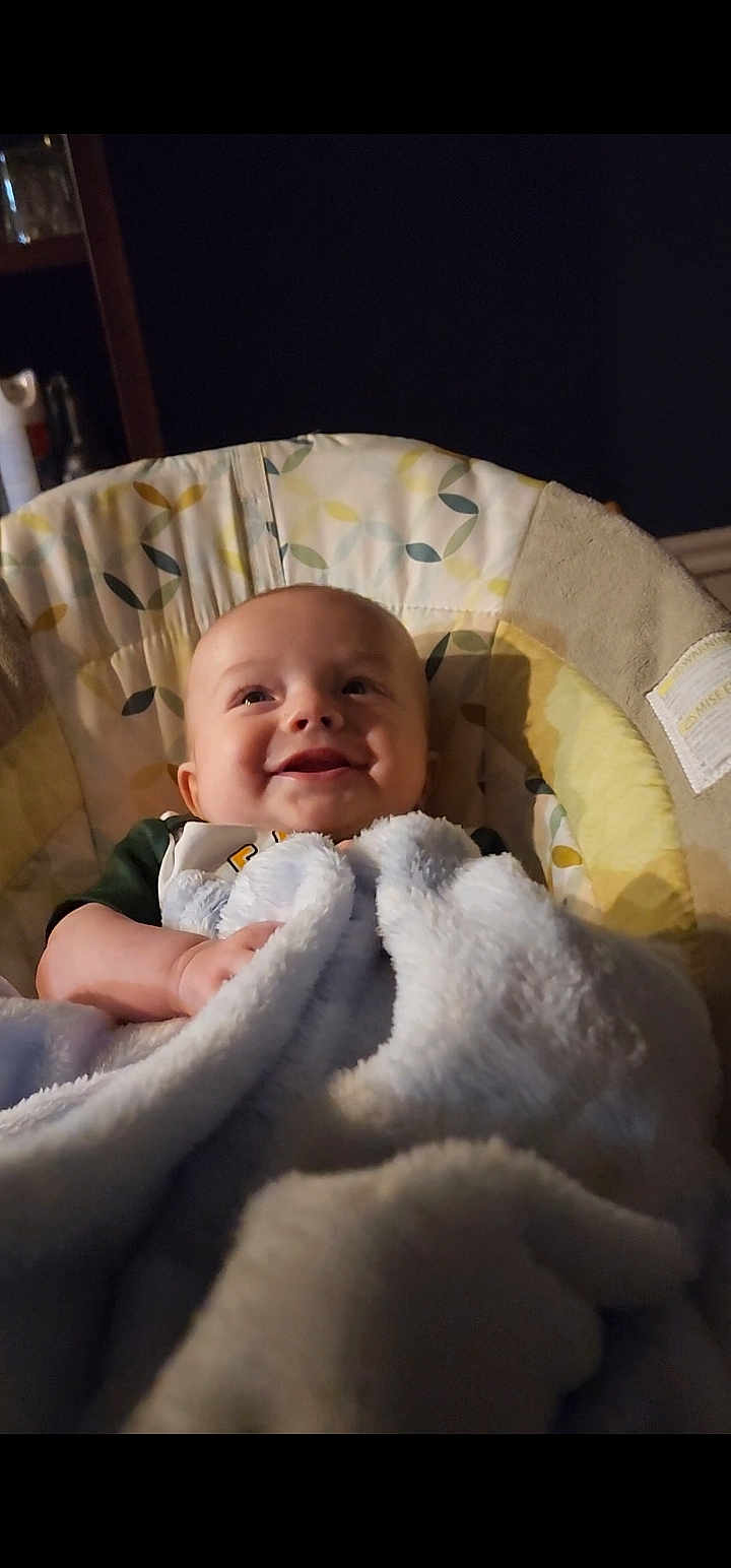 Tobias joined the competition — help win amazing prizes! baby, blanket, smiling, infant, face, baby_seat, cozy, happy, child, indoor, soft, cute, portrait, clothing, comfort, toddler, expression, warm, young, resting