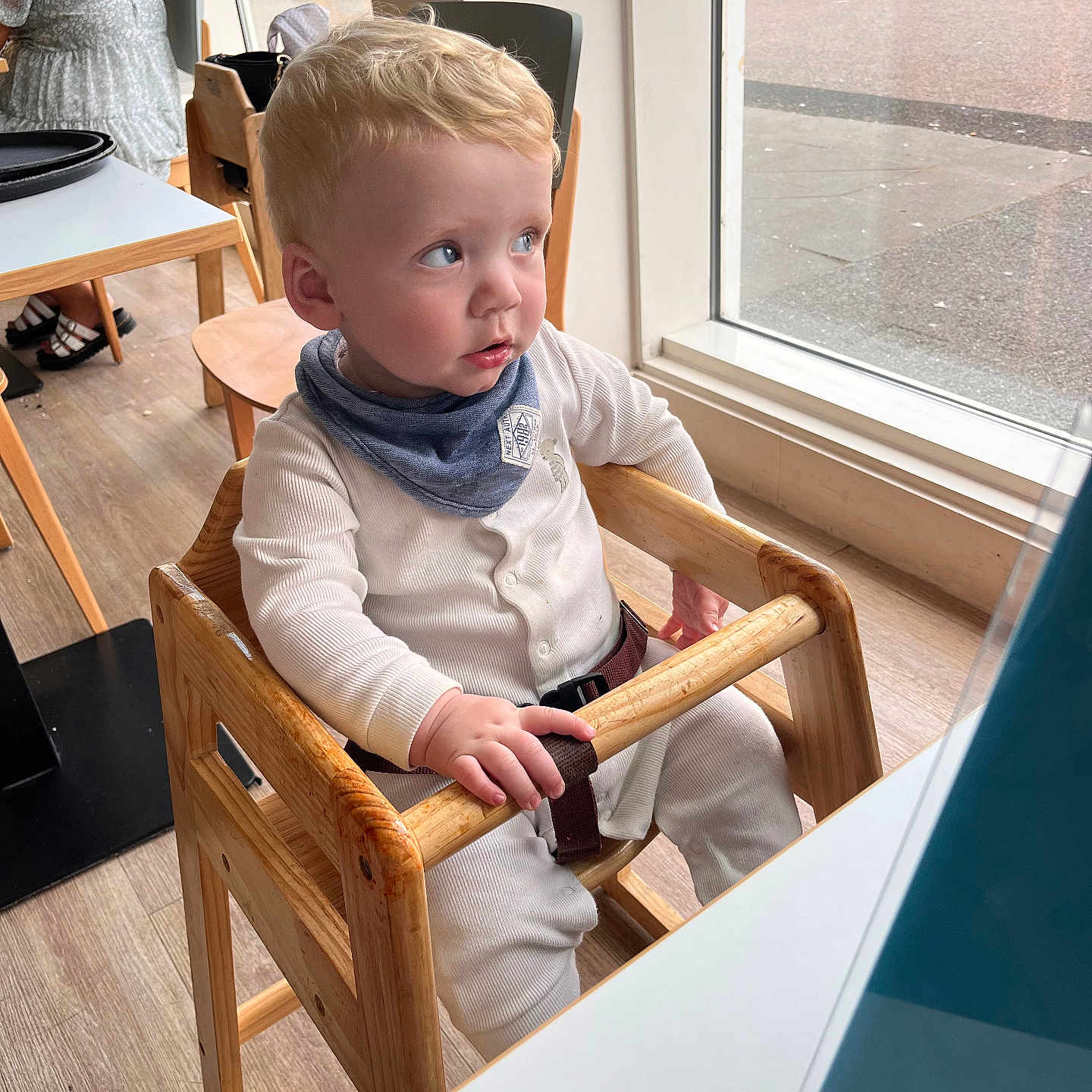 Frank is registered to the contest to win money with this photo: baby, chair, clothing, face, footwear, furniture, hairdresser, head, highchair, indoors, interiordesign, person, photography, plywood, portrait, shoe, sitting, student, wood