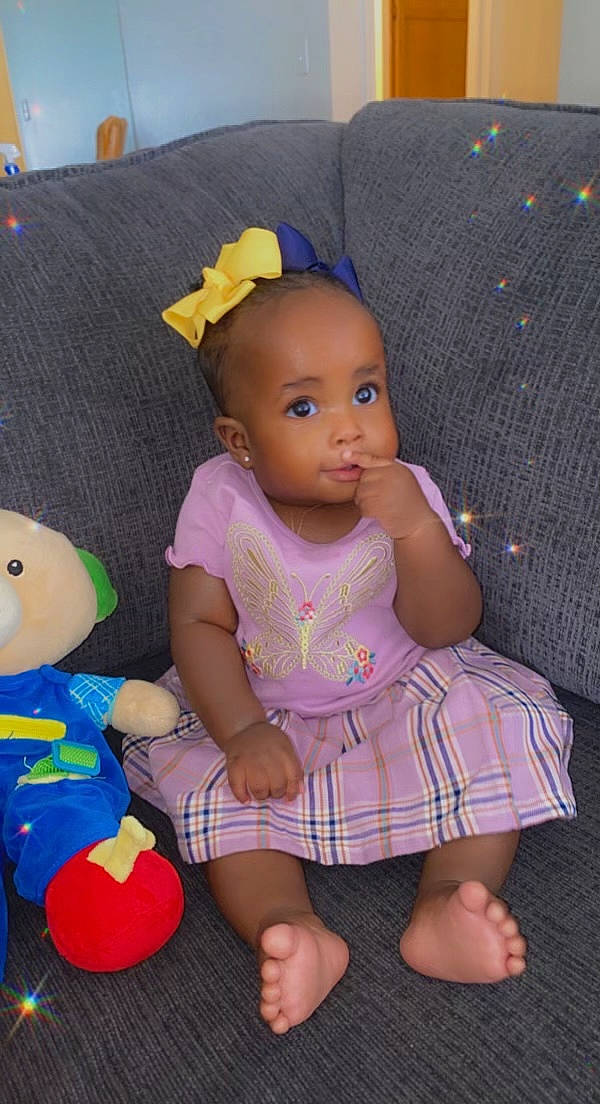 Angelina is registered to the contest to win money with this photo: baby, baby_products, baby_toddler_clothing, cheek, child, design, doll, dress, fun, pattern, person, pink, product, purple, skin, stuffed_toy, textile, toddler, toy, violet