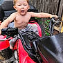 Remmington joined the competition — help win amazing prizes! baby, clothing, device, face, grass, head, lawn, lawnmower, machine, motorcycle, person, photography, plant, portrait, shorts, spoke, summer, tool, transportation, vehicle